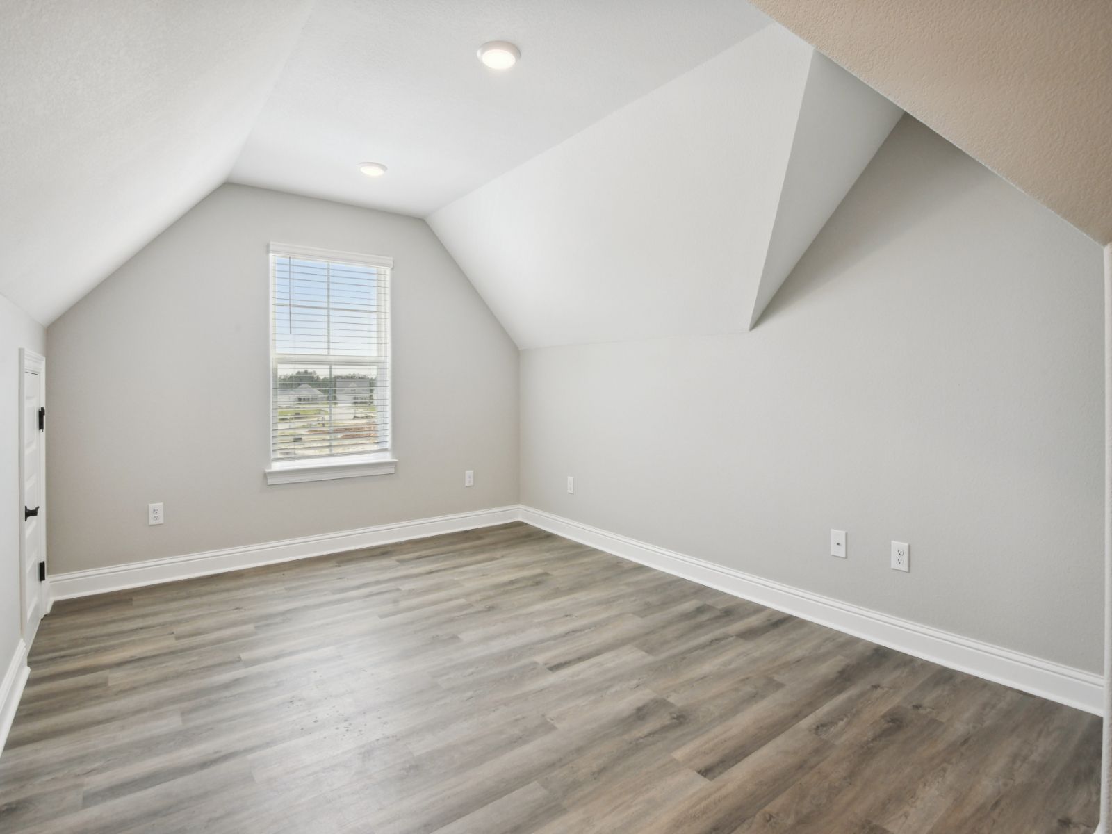 GLF_ElliottHomes_Jules_A335_BonusRoom.jpg:Flex room in the Jules floorplan at a Meritage Homes community in Gulfport, MS.