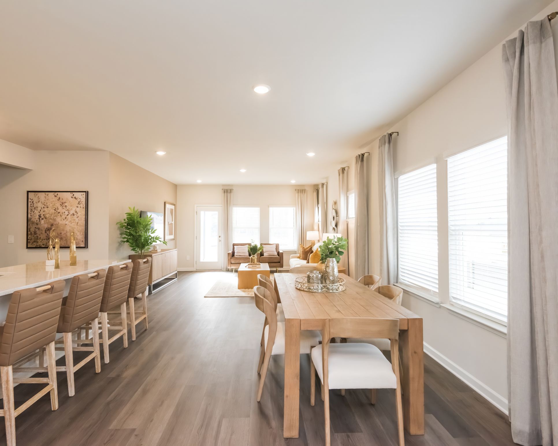 Gather the family around the dining table, at the heart of the open-concept living area.