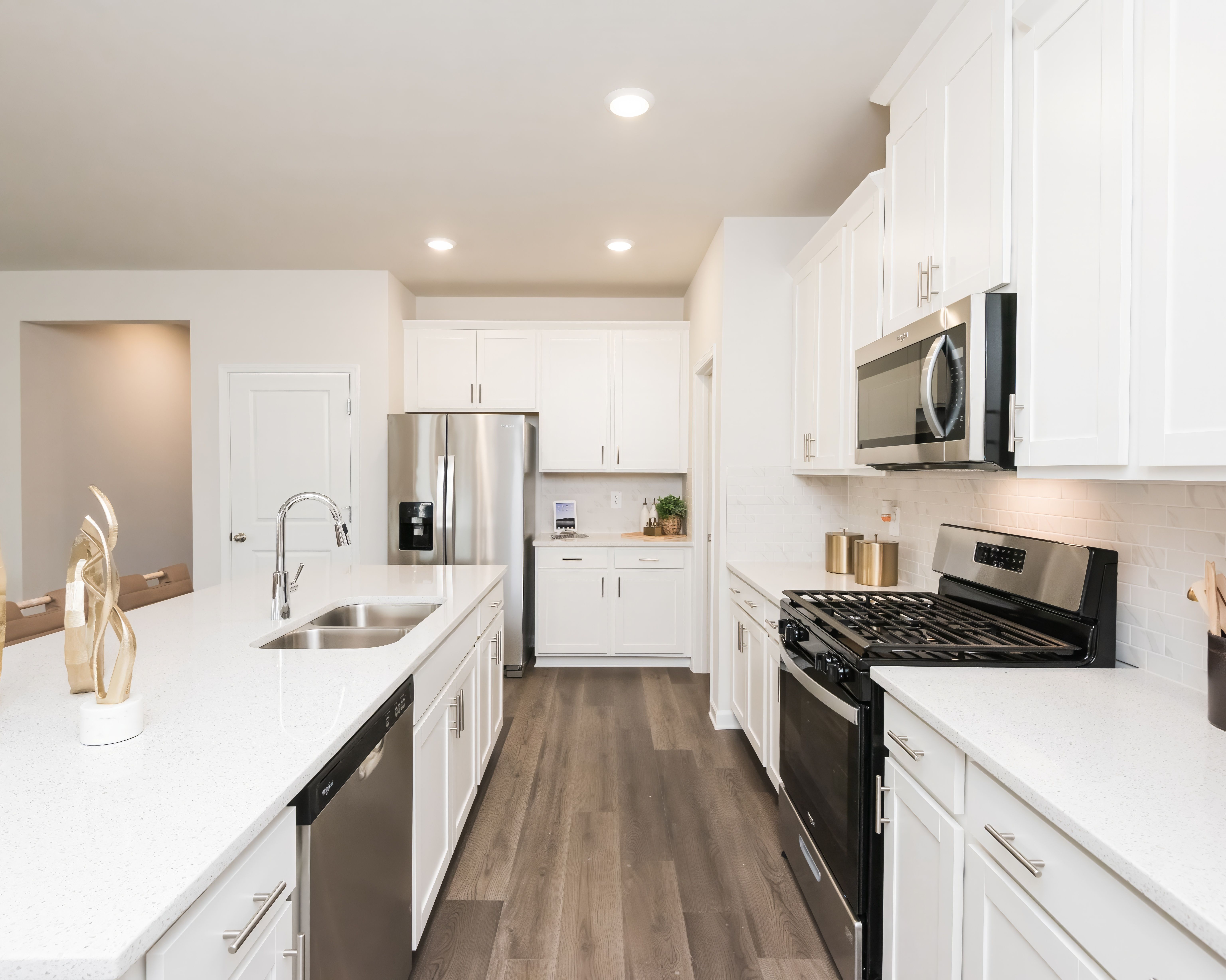 Kitchen:The Paisley floorplan with the Balanced White interior package modeled at Martin Springs.
