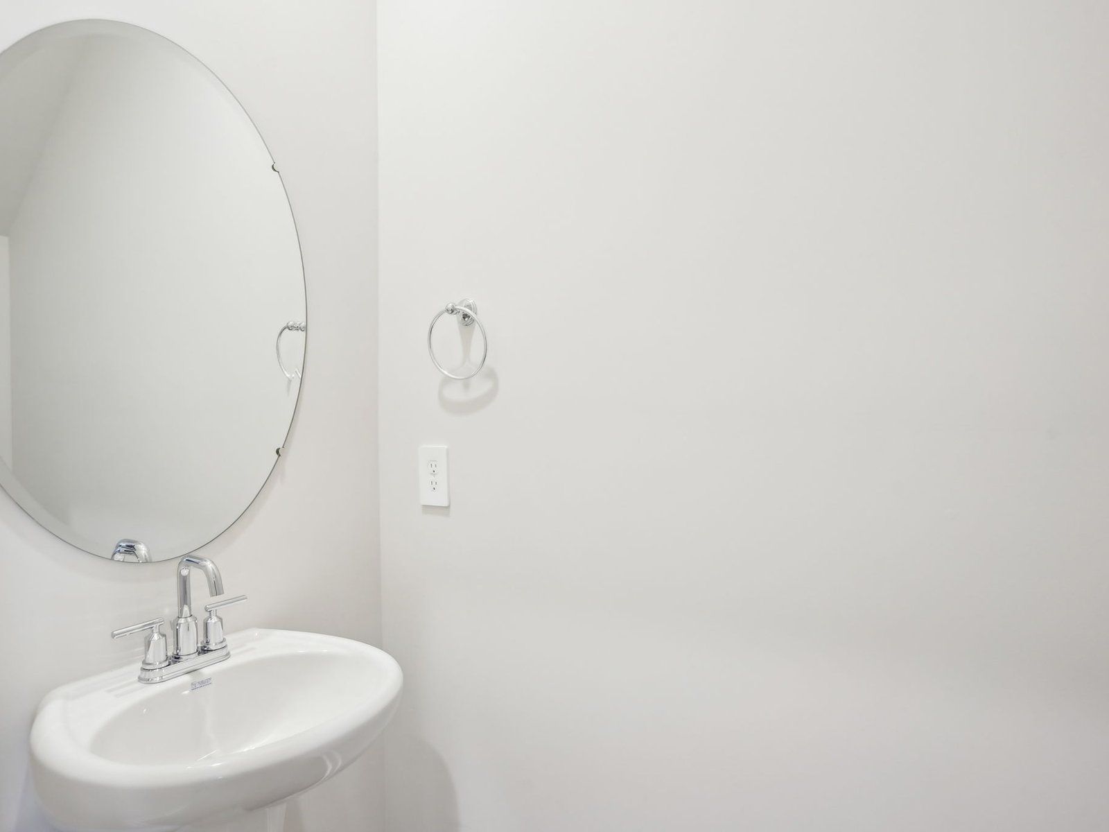 Half Bathroom:The half bathroom is conveniently located on the first floor for guests and visitors.