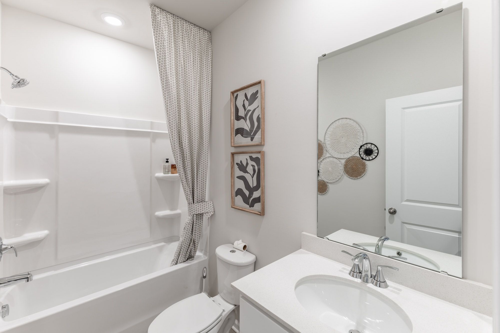 Secondary Bathroom:The Gibson floorplan with the Lush White interior package modeled at Madison Preserve.