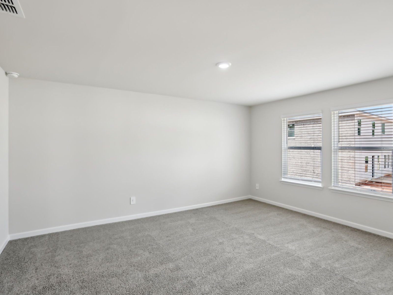 Primary Bedroom:The Dakota floorplan with the Distinct Grey interior package.
