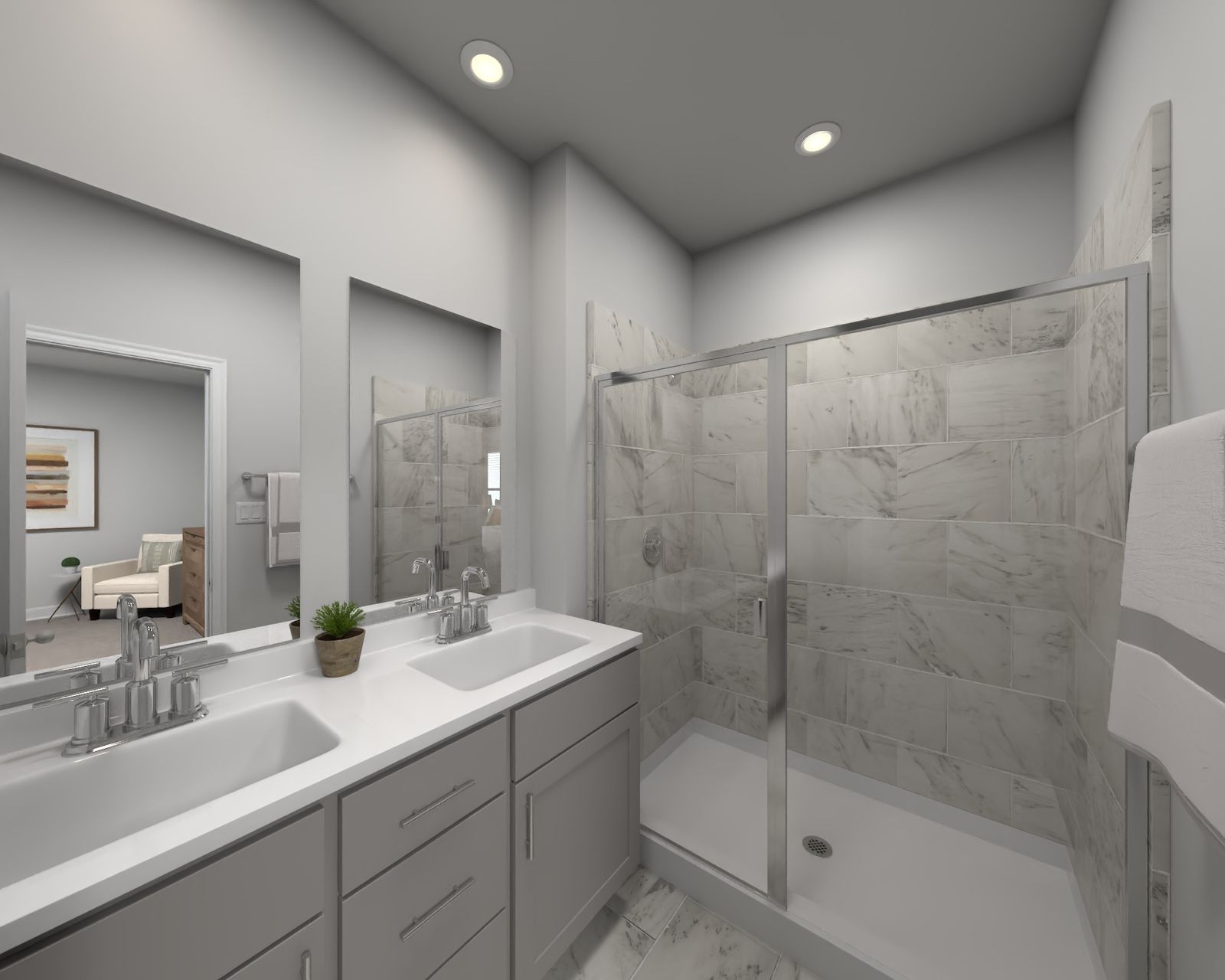 The primary bathroom offers dual vanity sinks and a walk-in shower.:Primary Bathroom