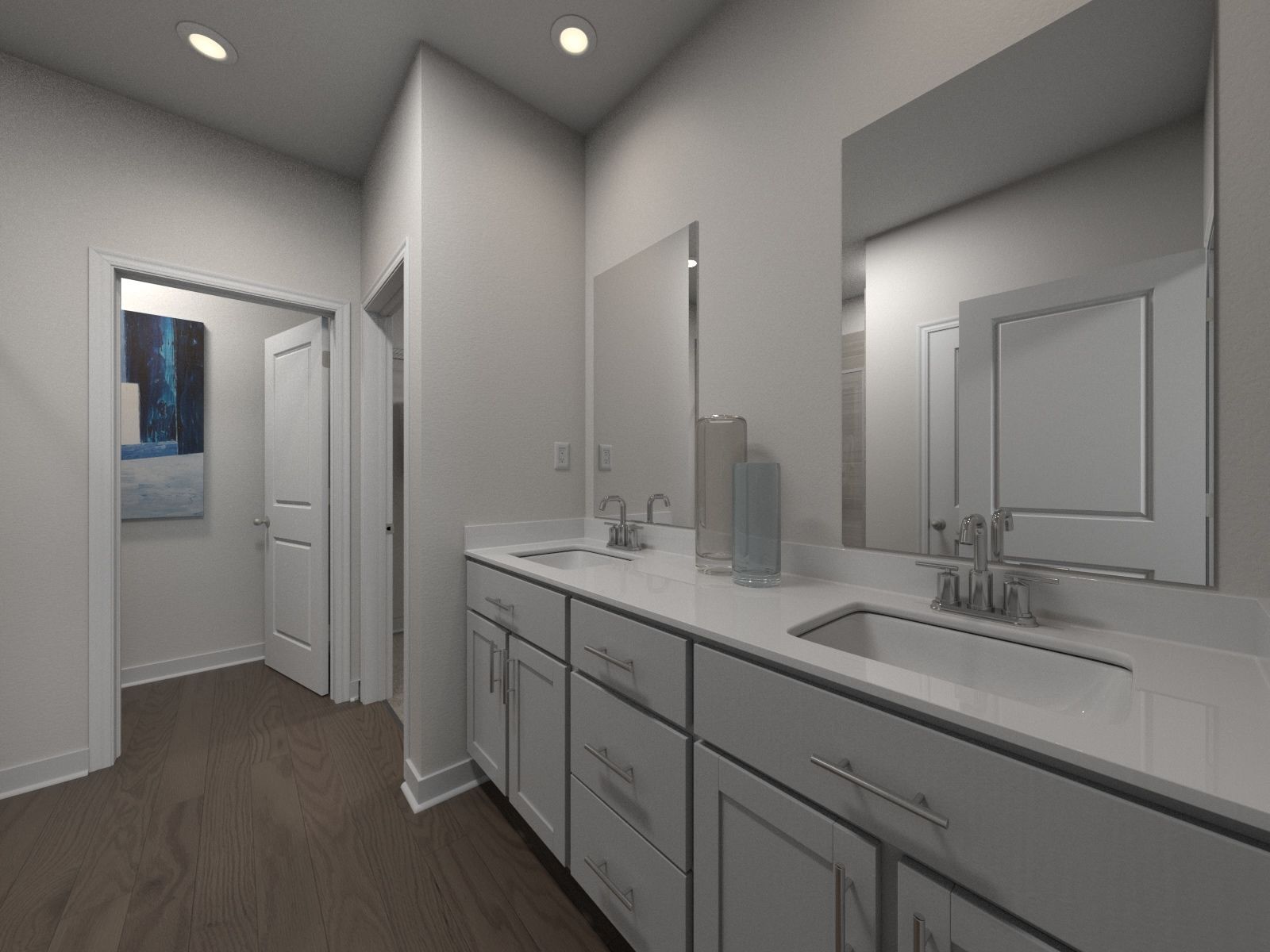 Primary Suite Bathroom:The primary bathroom offers dual vanity sinks and a walk-in shower.