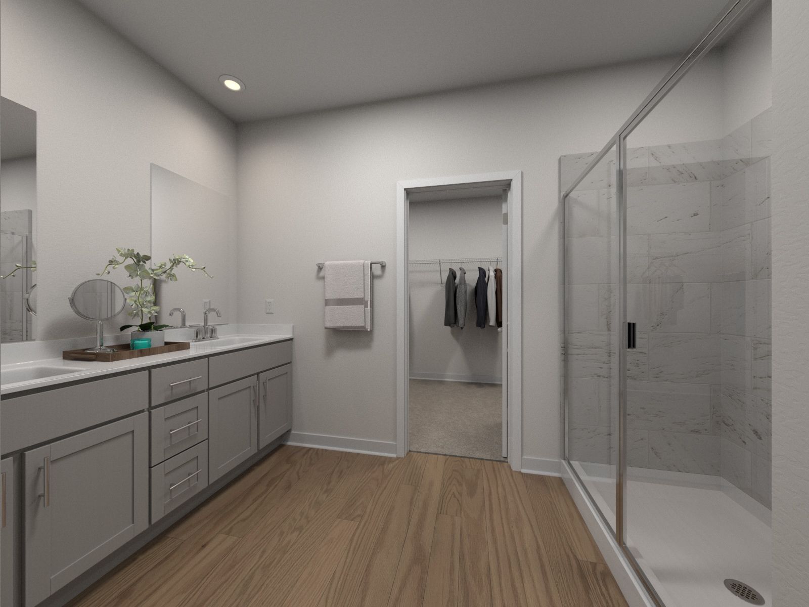 The primary bathroom offers dual vanity sinks and a walk-in shower.:Primary Bathroom