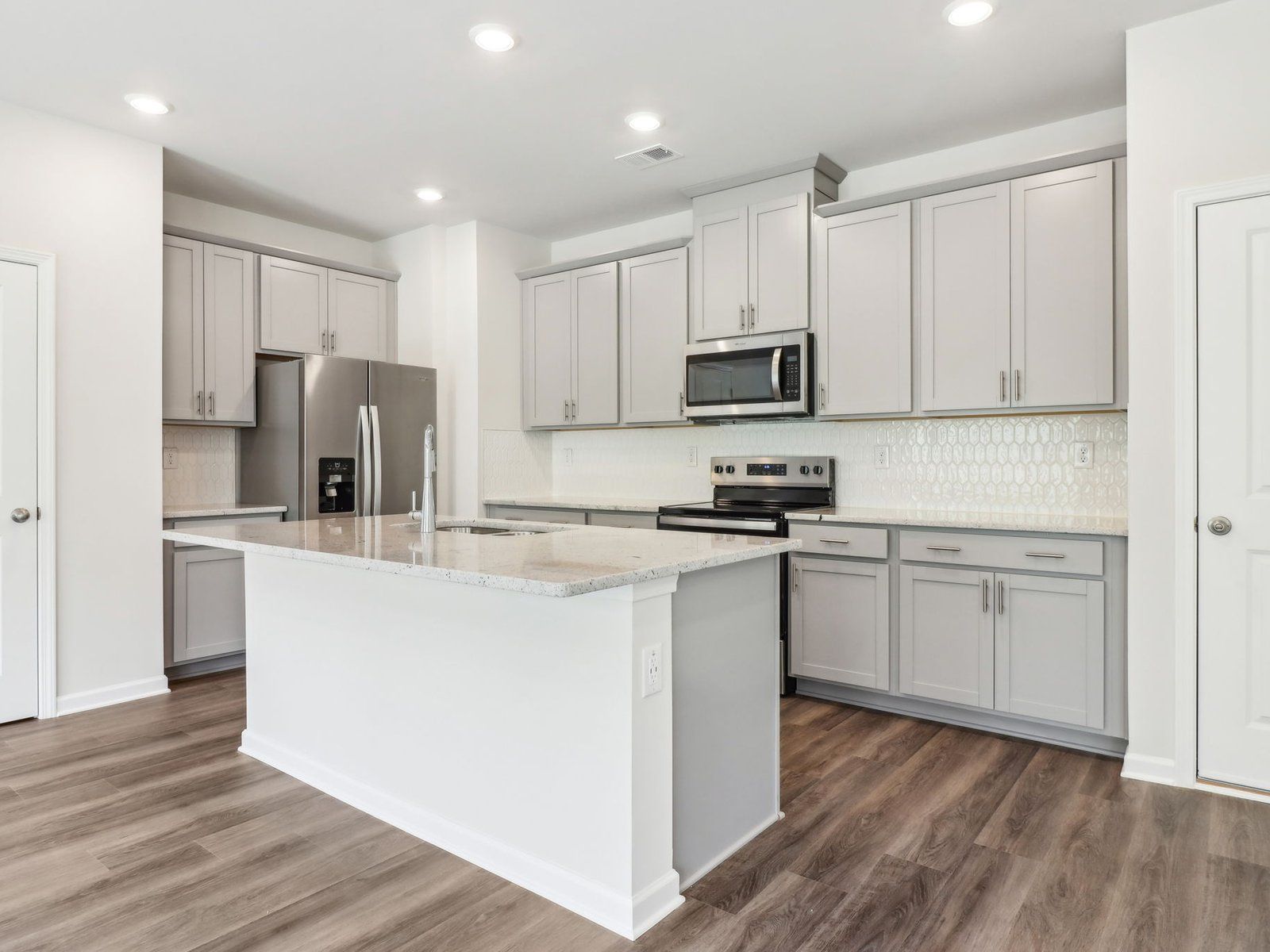 The Lennon floorplan with the Distinct Grey Interior Package.:Kitchen