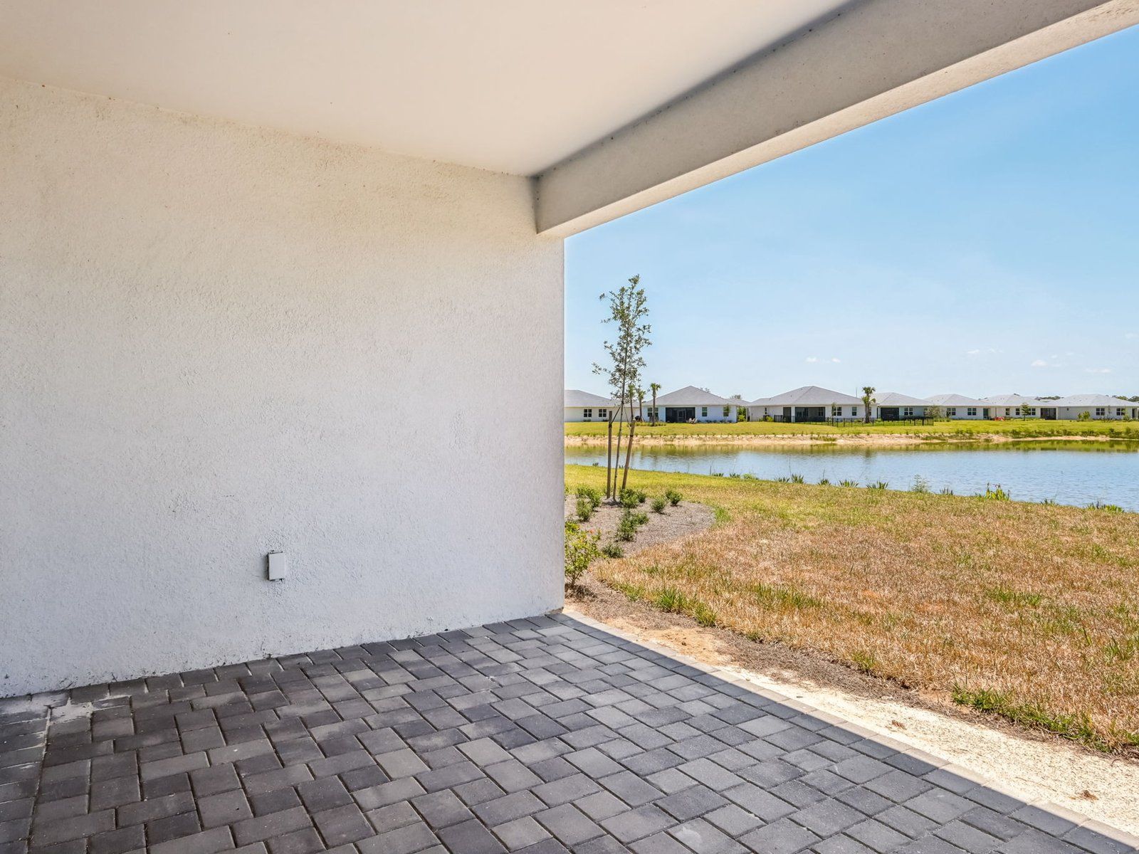 Covered lanai of the Willet floorplan at 16504 Seven Lakes Avenue.:Back Patio