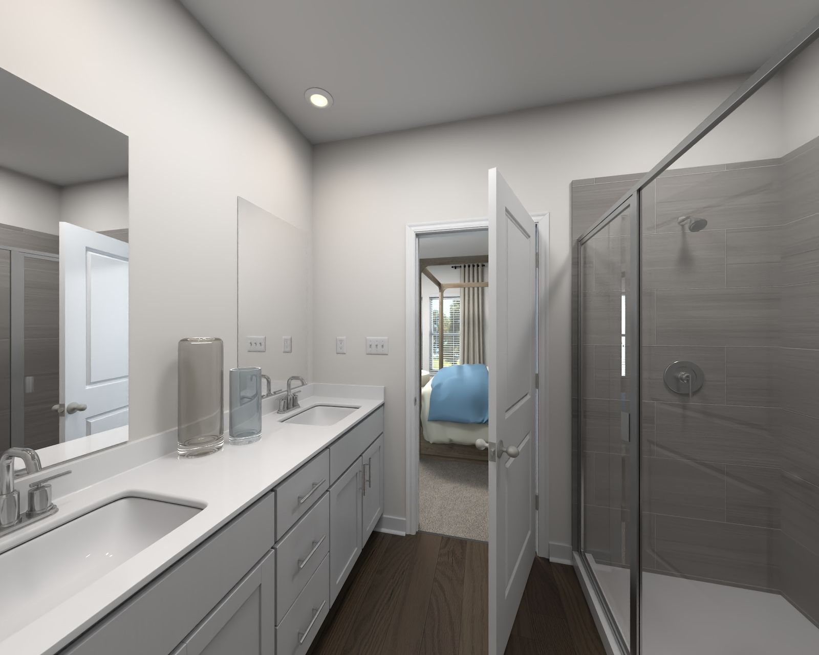 The primary bathroom offers dual vanity sinks and a walk-in shower.:Primary Bathroom
