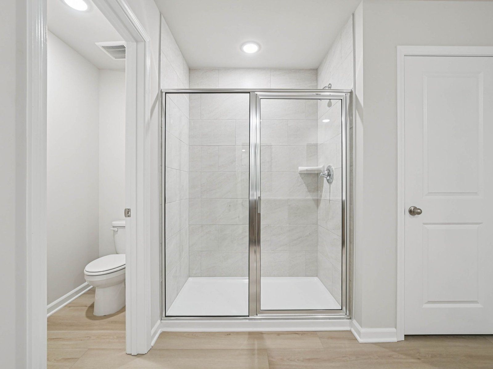 Primary Bathroom:Primary bathroom in the Johnson floorplan at Cadence Meadows in Zebulon, NC.