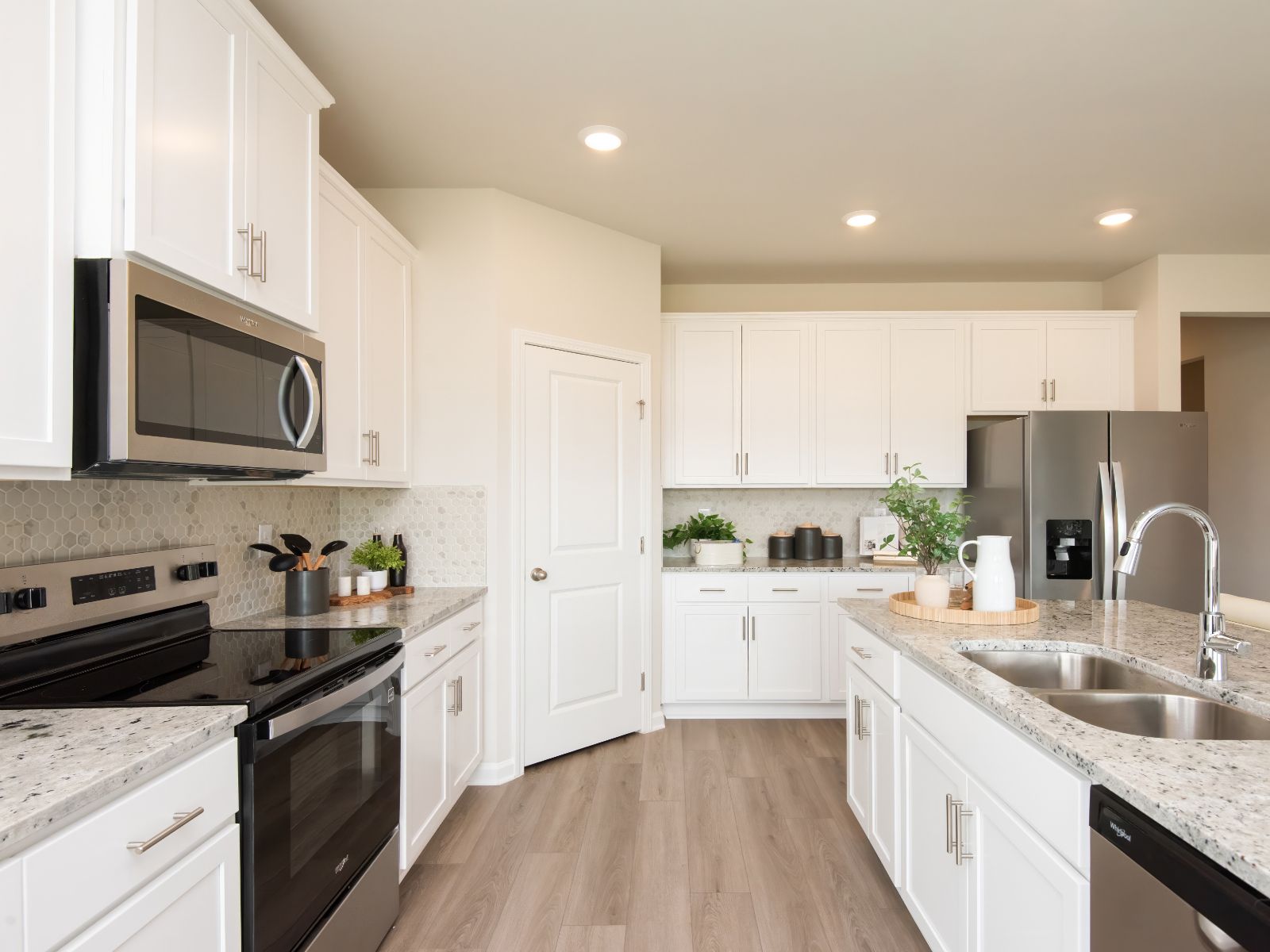 Kitchen:The Northbrook floorplan with the Elemental White interior package modeled at Kendall Farms.