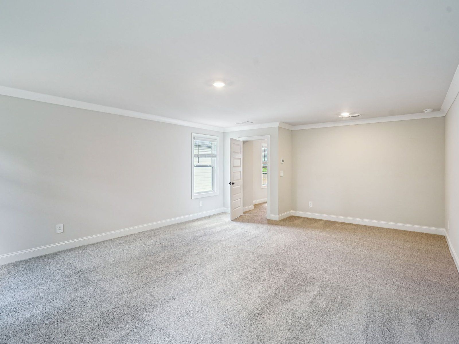 Primary Bedroom:The Taylorsville Basement floorplan with the Distinct Gray interior package.