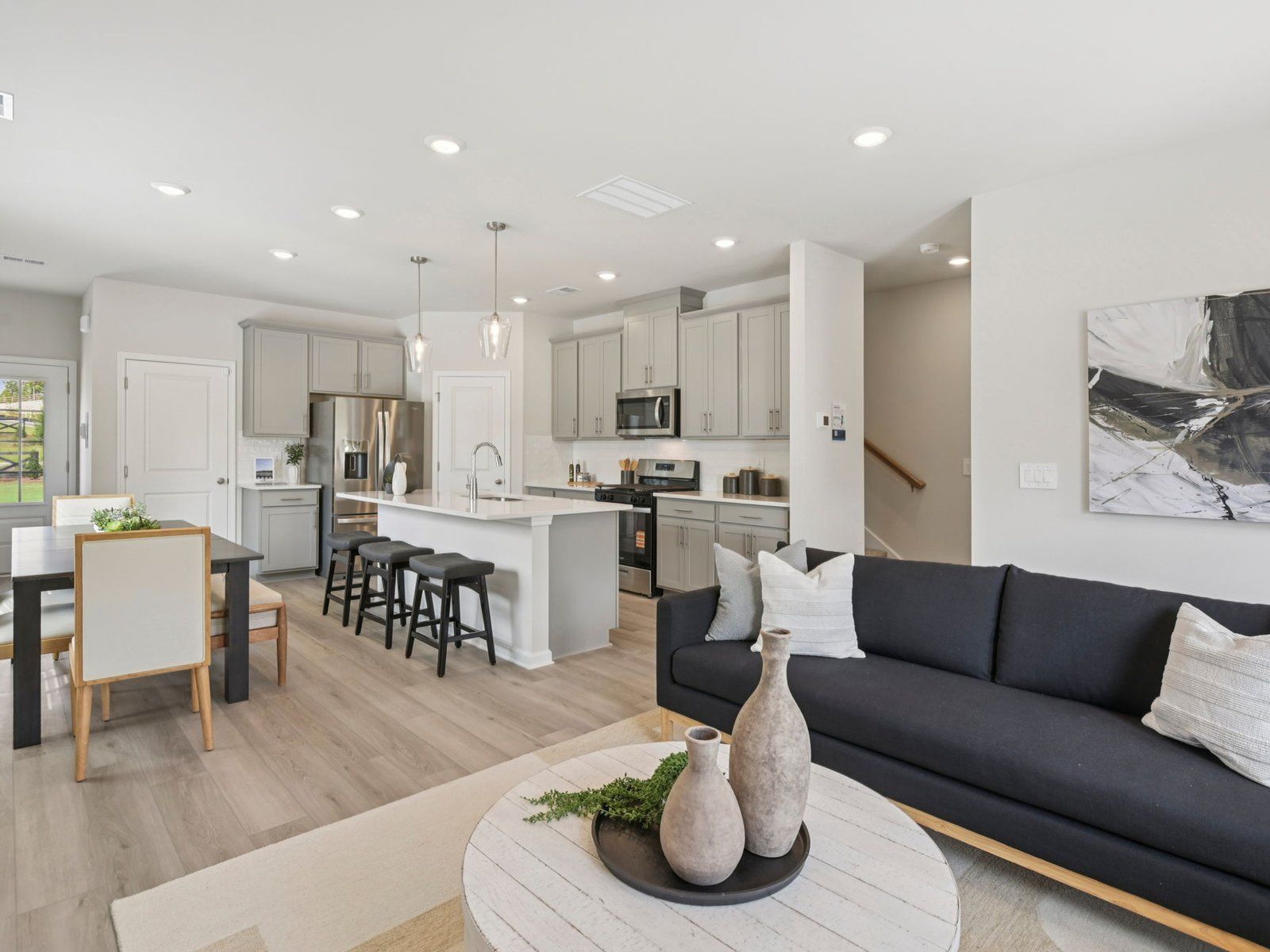 Great Room:The Oakland floorplan with the Fresh Grey interior package modeled at Artisan Walk.