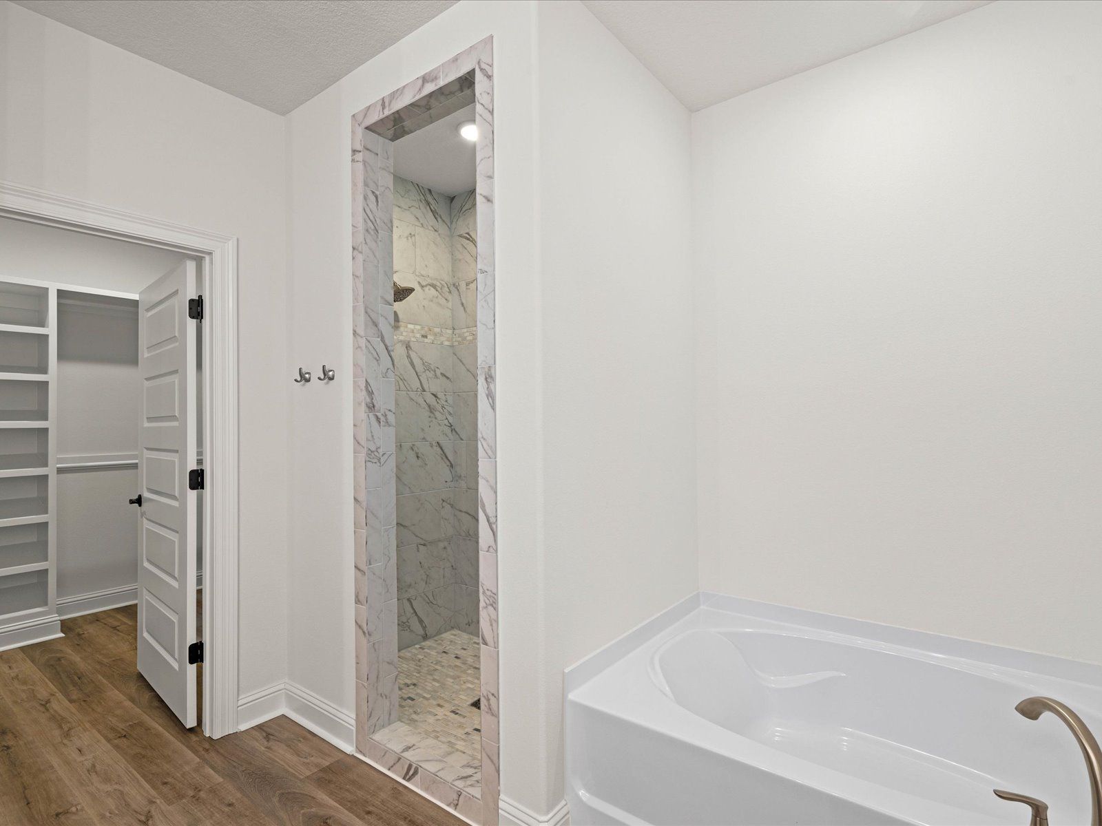 Primary bathroom in the Claiborne floorplan at a Meritage Homes community in Ocean Springs, MS.:Primary Bathroom