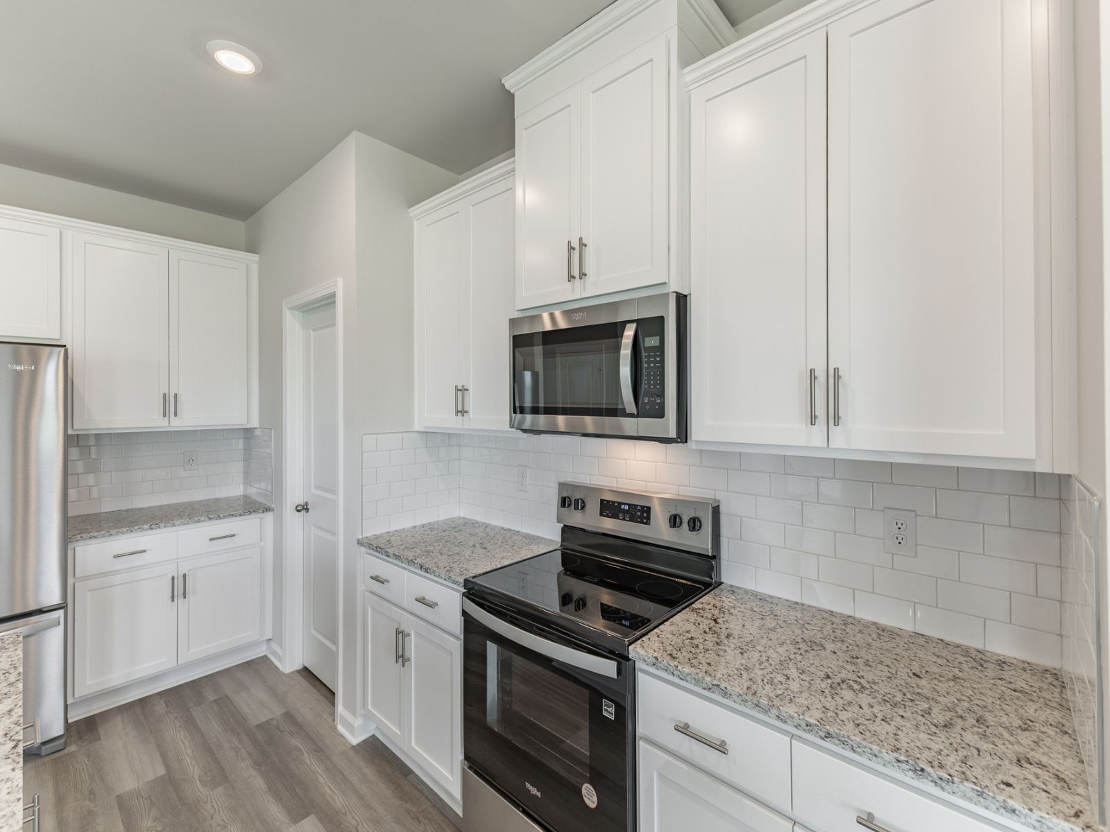 The Carolina floorplan with the Crisp White interior package.:Kitchen