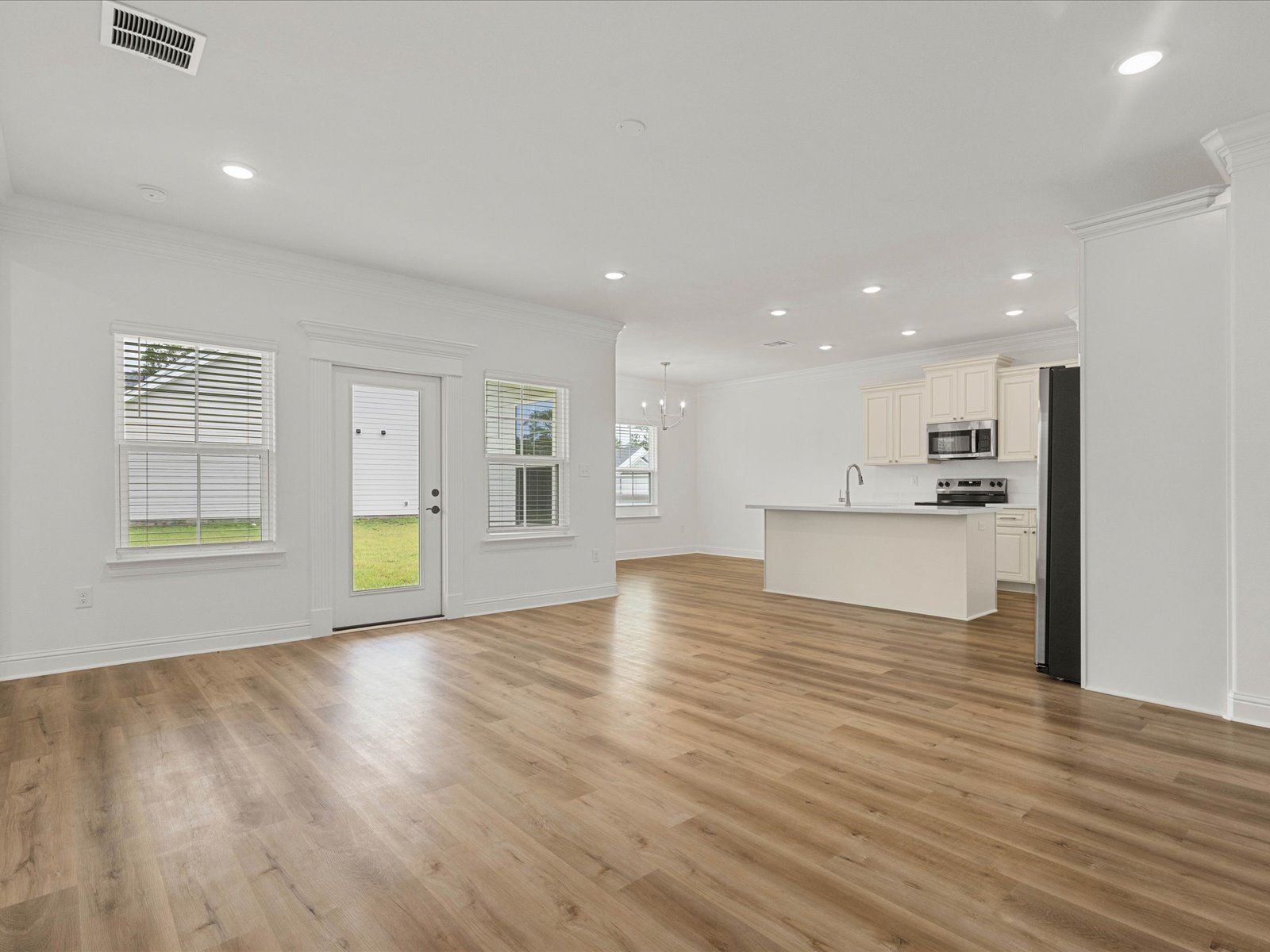 Great room in the Coral floorplan at a Meritage Homes community in Gulfport, MS.:Great Room