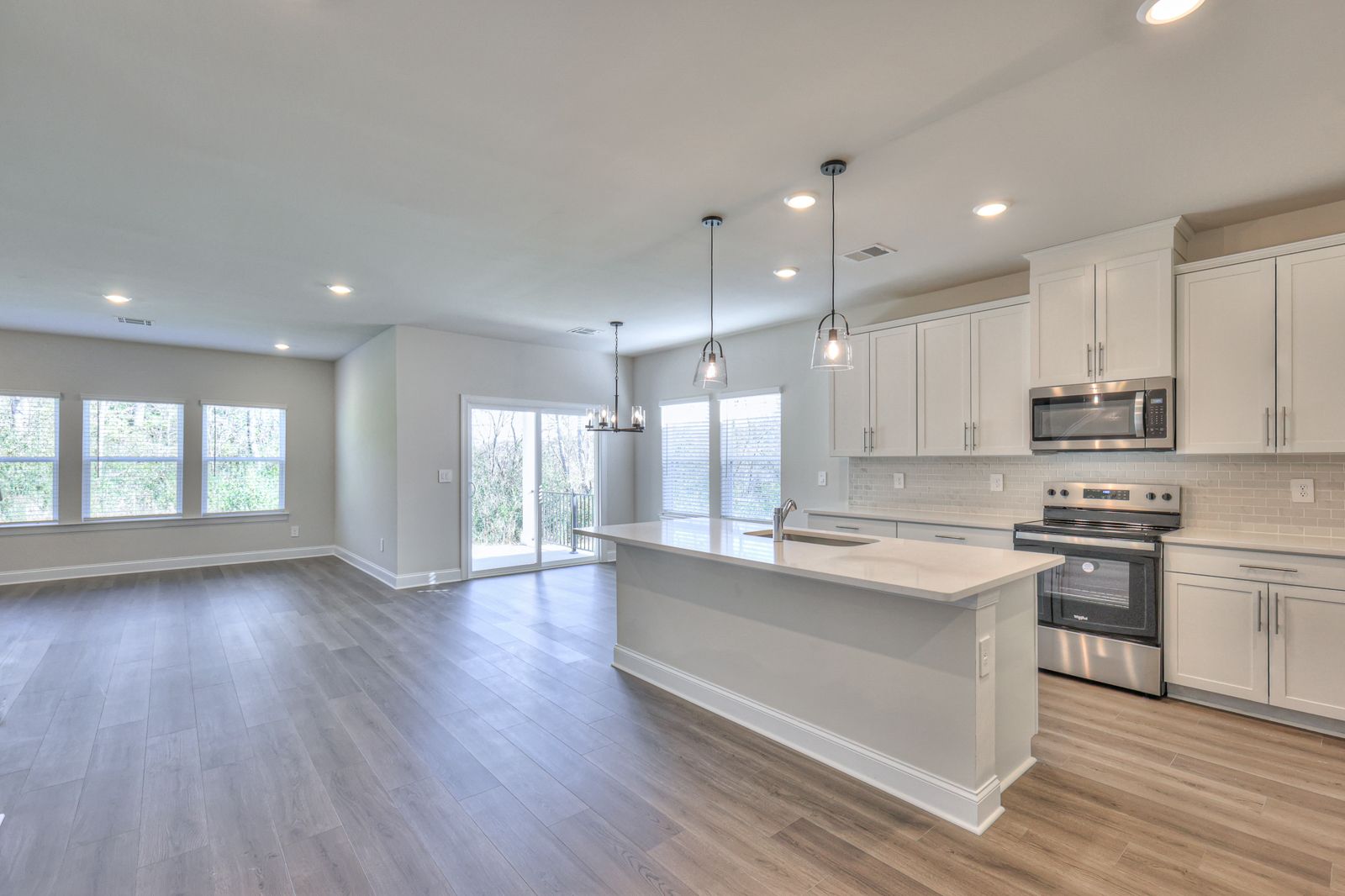 Enjoy your morning coffee at the stunning kitchen island.:NSH_Wyncliff_Sherwood_Kitchen_1247BlufftonCircle.jpg