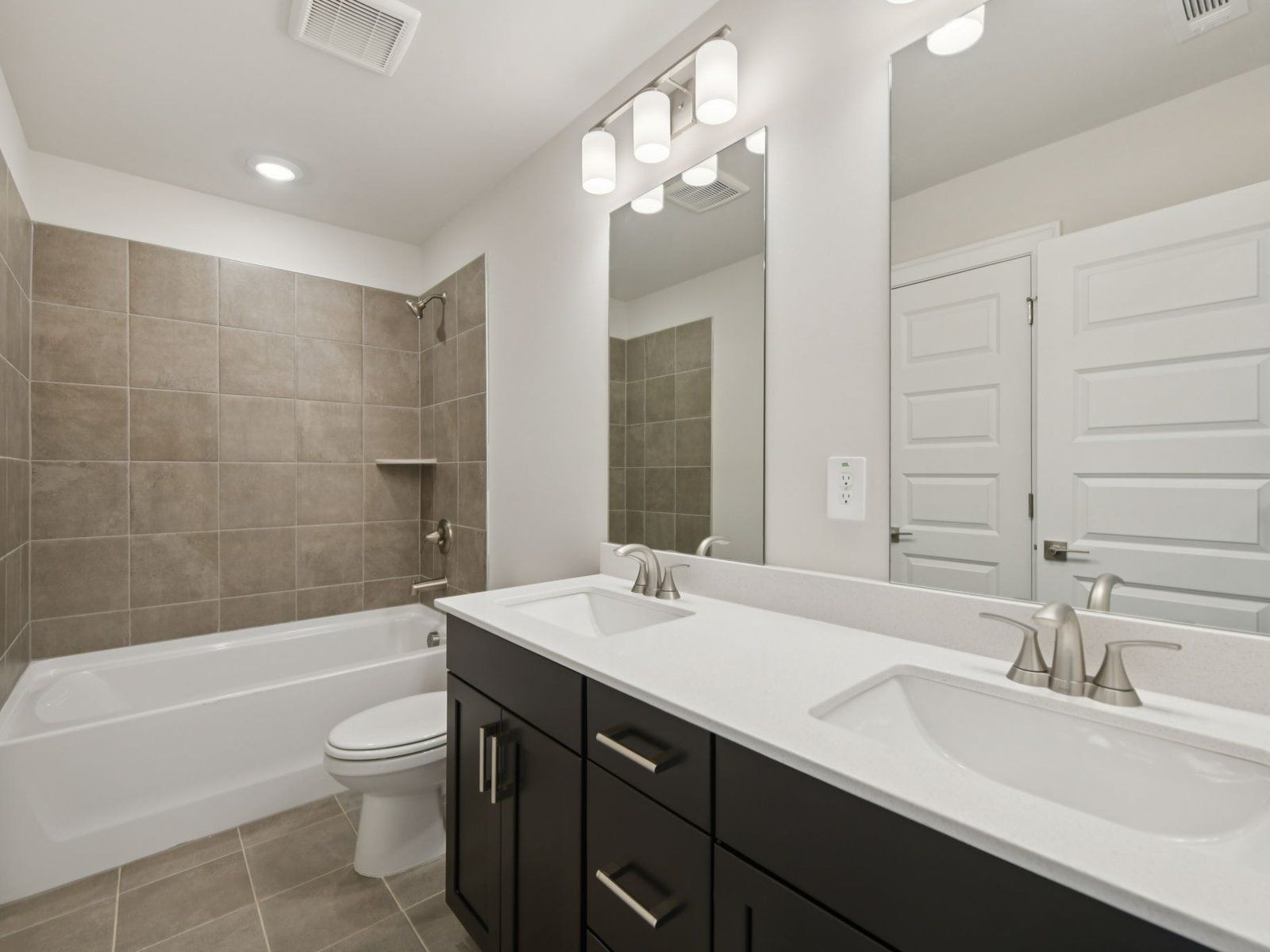 Secondary Bathroom:The Leighton floorplan with the Timeless Contrast Black interior package.