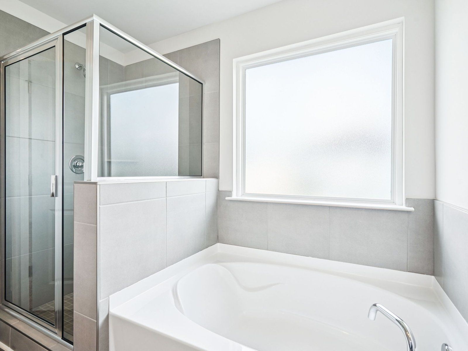 Primary Bathroom:The Chatham floorplan with the Distinct Gray interior package.