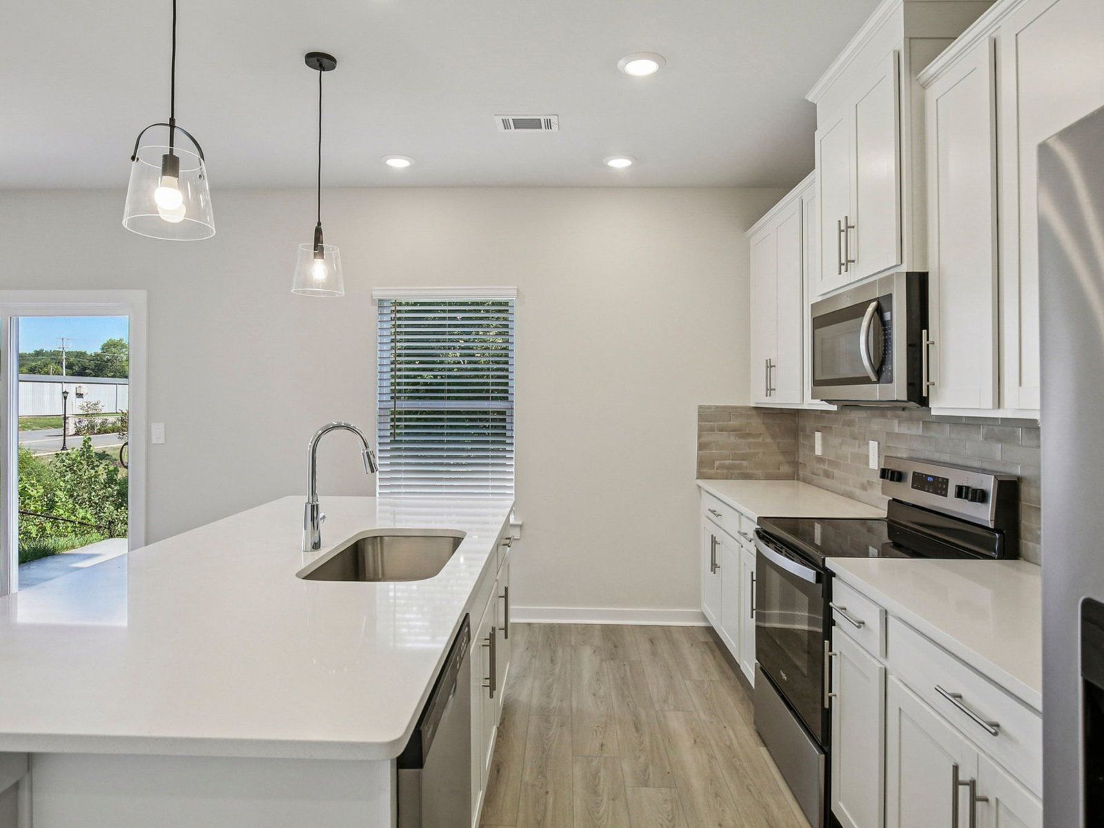 Prep dinner in the kitchen without missing the conversation in the great room.:Kitchen