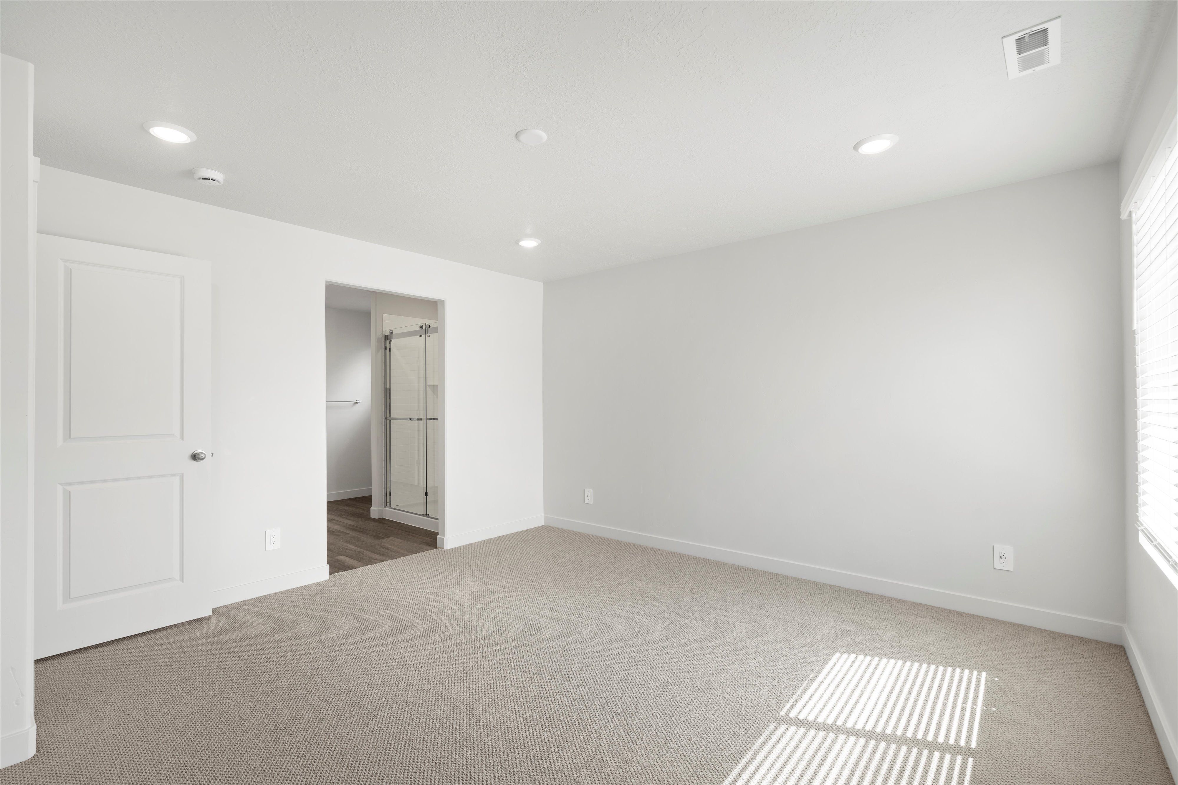 Primary Bedroom:The Cottonwood floorplan interior image taken at a Meritage Homes Community in Eagle Mountain, UT.