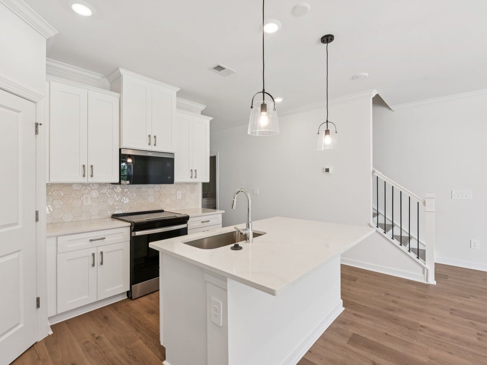 Kitchen:Turn the oversized kitchen island into a bar counter for additional seating.