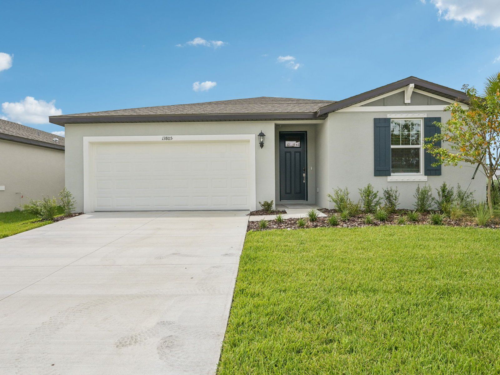 The Exterior of the Hibiscus Floorplan at 13805 Richland Gulf Cir.:1-custom-Tampa - Salt Meadows - 13805 Richland Gulf Cir Parrish FL 34219-001.jpg