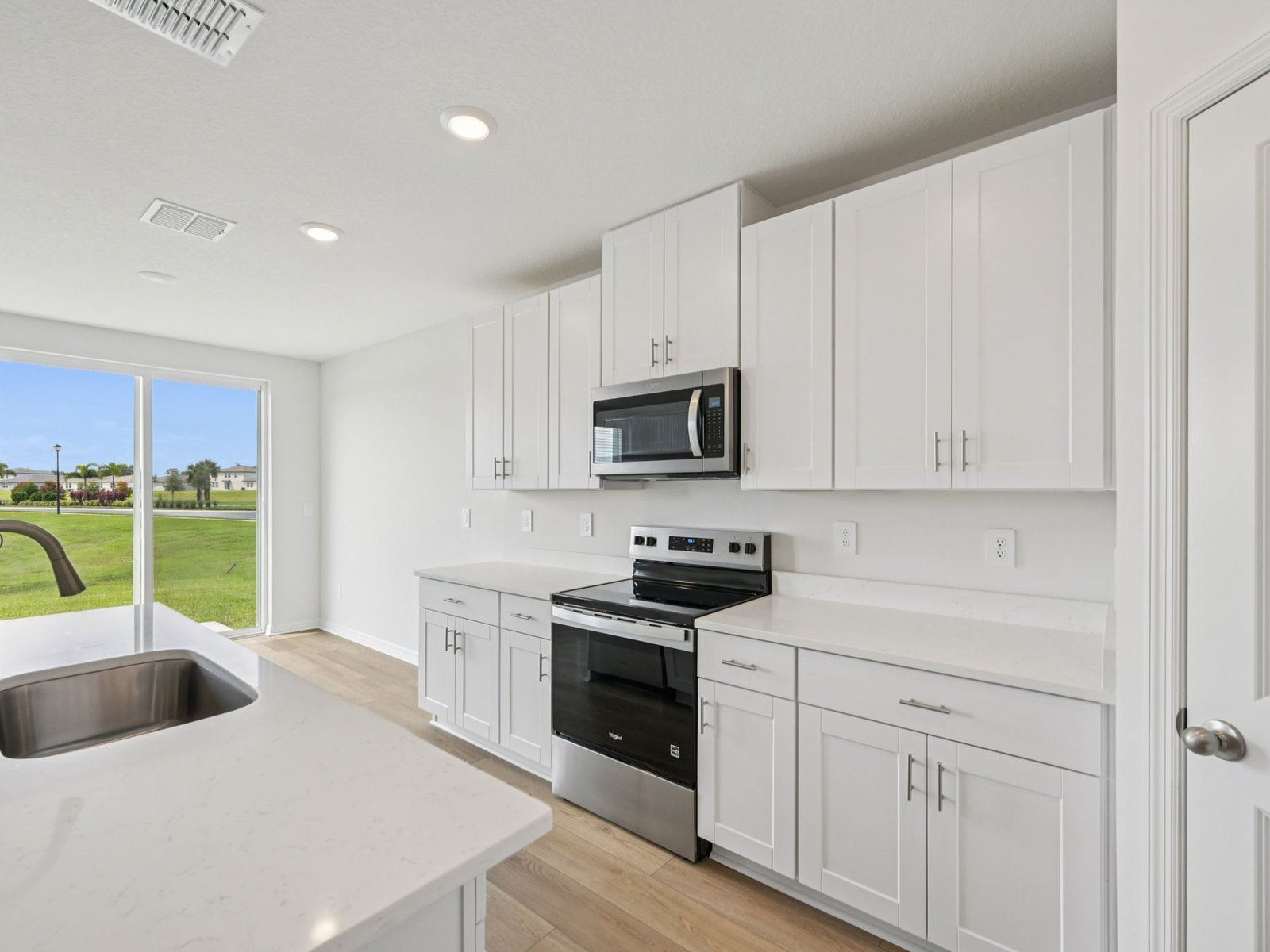 The Kitchen of the Hibiscus Floorplan at 13805 Richland Gulf Cir.:8-custom-Tampa - Salt Meadows - 13805 Richland Gulf Cir Parrish FL 34219-008.jpg