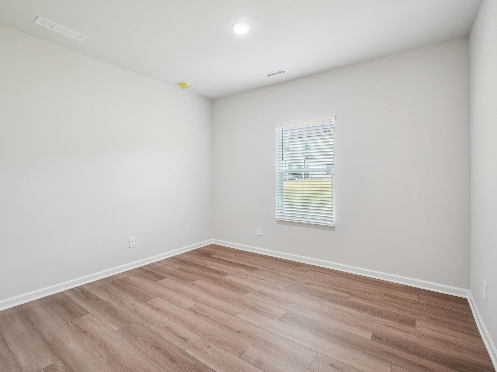 Secondary bedroom in the Paisley floorplan at a Meritage Homes community in Garner, NC.:Secondary Bedroom