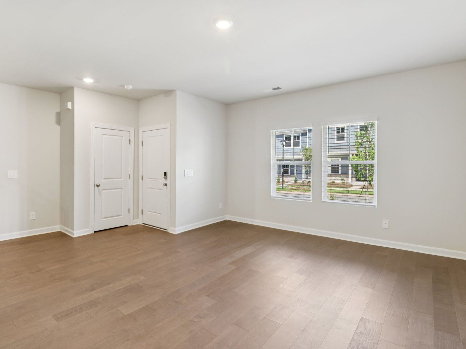 The great room offers an abundance of natural light.:Great Room