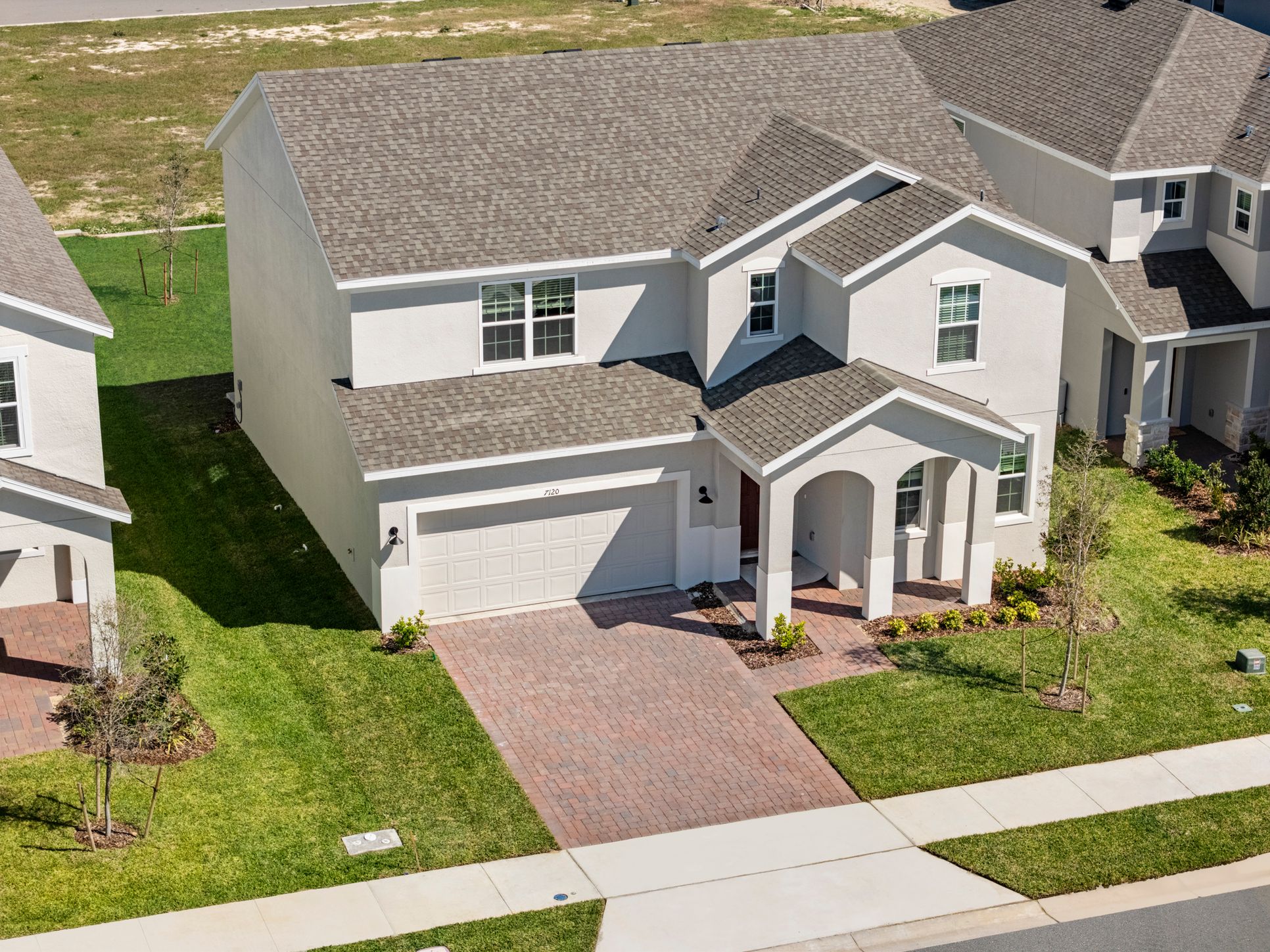 Trinity-Lakes-Newcastle-Front Exterior Aerial-2100x1400-Risewell-Homes
