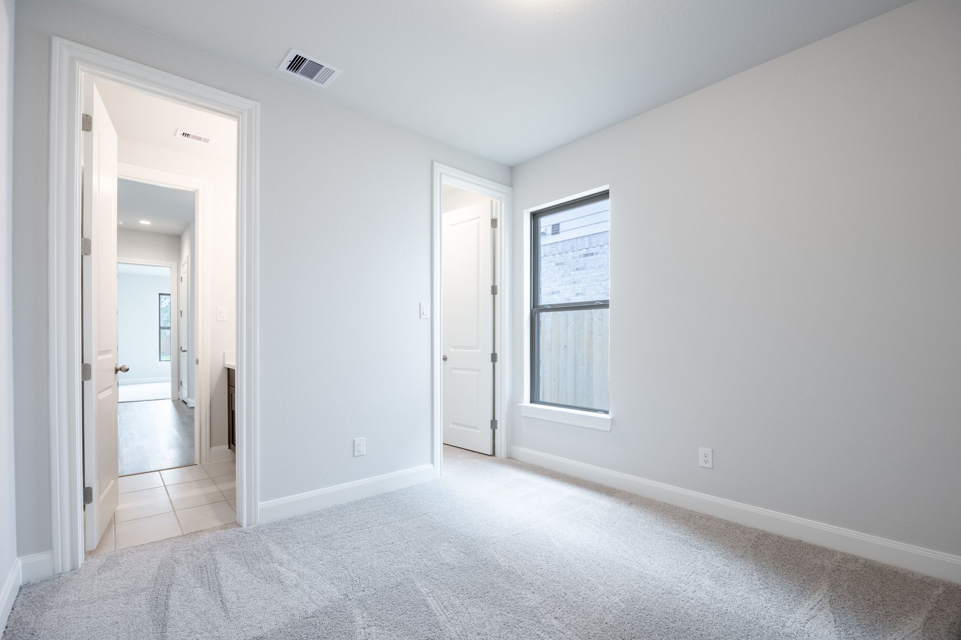 Sunterra - Homesite 82 - Bedroom - Homesite Photography