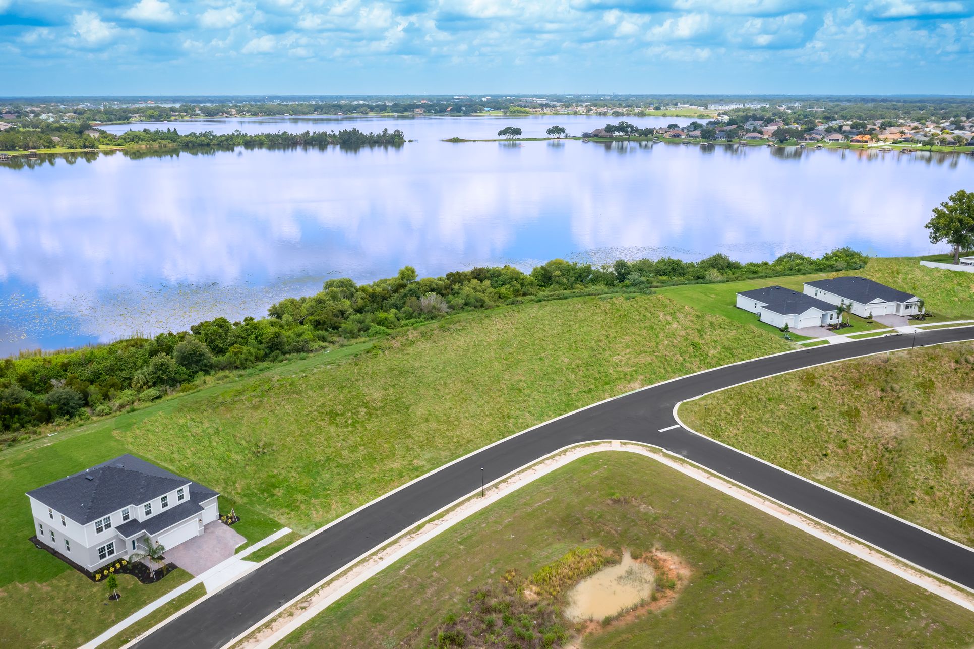 Choose from ½-acre or corner homesites with lake views, 3-car garages, and upscale features.:Schedule a homesite tour!