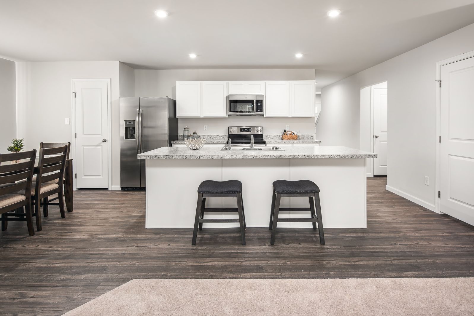 OPEN CONCEPT LIVING WITH APPLIANCES:Your new, open concept home comes complete with a range, microwave, dishwasher, and refrigerator, plus the washer and dryer. All you have to focus on is the guest list for your housewarming party!