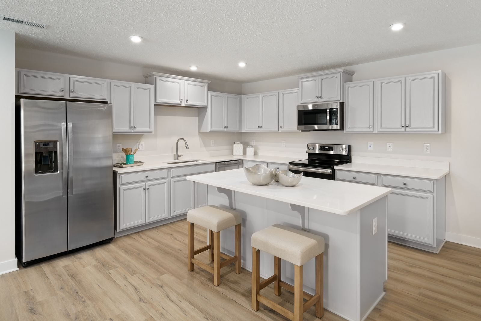 EVERYTHING YOU NEED IS INCLUDED IN THE BASE PRICE:Granite countertops, center island, hard surface floors, stainless steel appliances, unfinished basement and more!