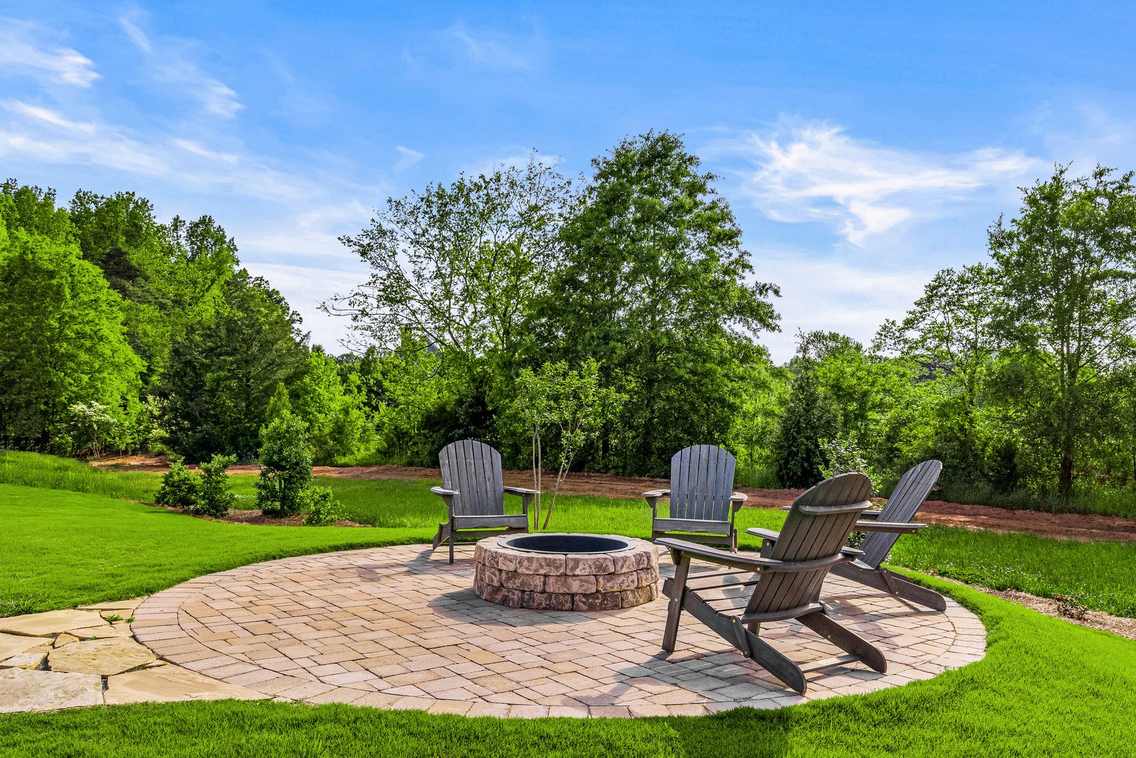 Private, wooded views and acreage of green space with walking trails:Your friends and neighbors will love the backyard for summer cookouts and get-togethers.