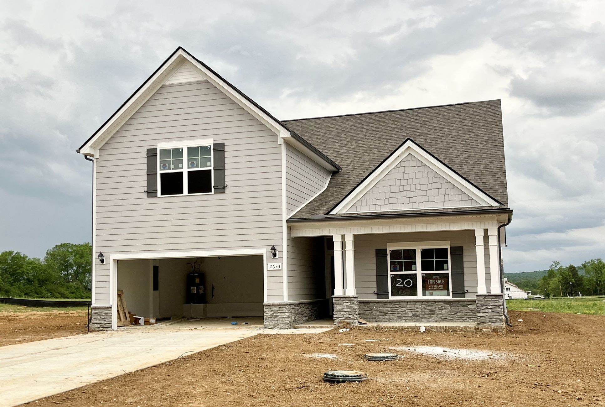 Exterior:Pearl Grey Hardie with stone accents. Wonderful home that feel much larger than it is. Vaulted grea