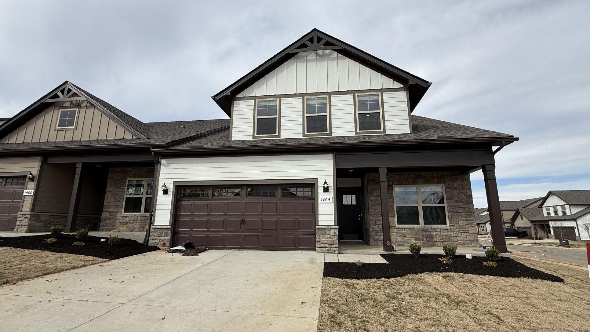 Exterior:File photo NEW end unit 3/3, 2 car, 2 bedrms down/2 bath, 1 bedrm/bath up, great rm/kitchen, covere