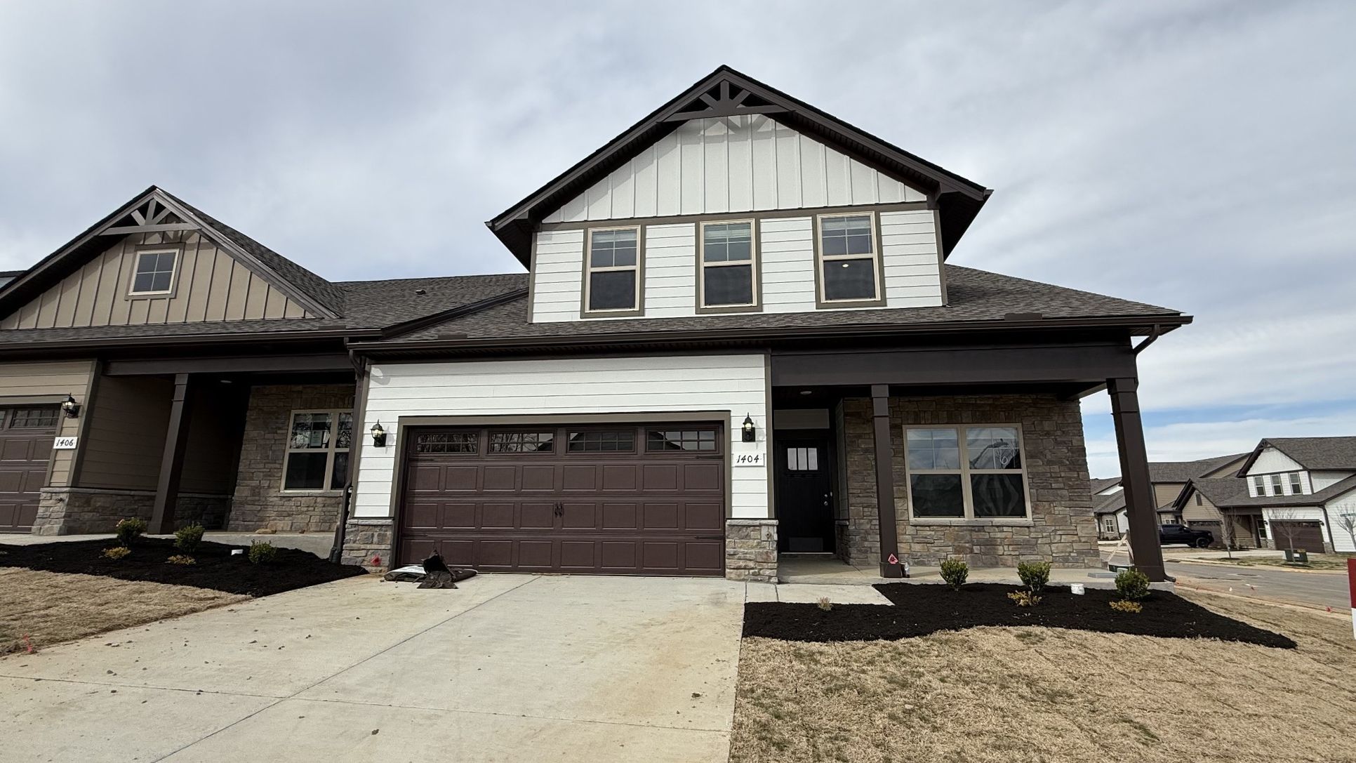 Exterior:File photo NEW end unit 3/3, 2 car, 2 bedrms down/2 bath, 1 bedrm/bath up, great rm/kitchen, covere
