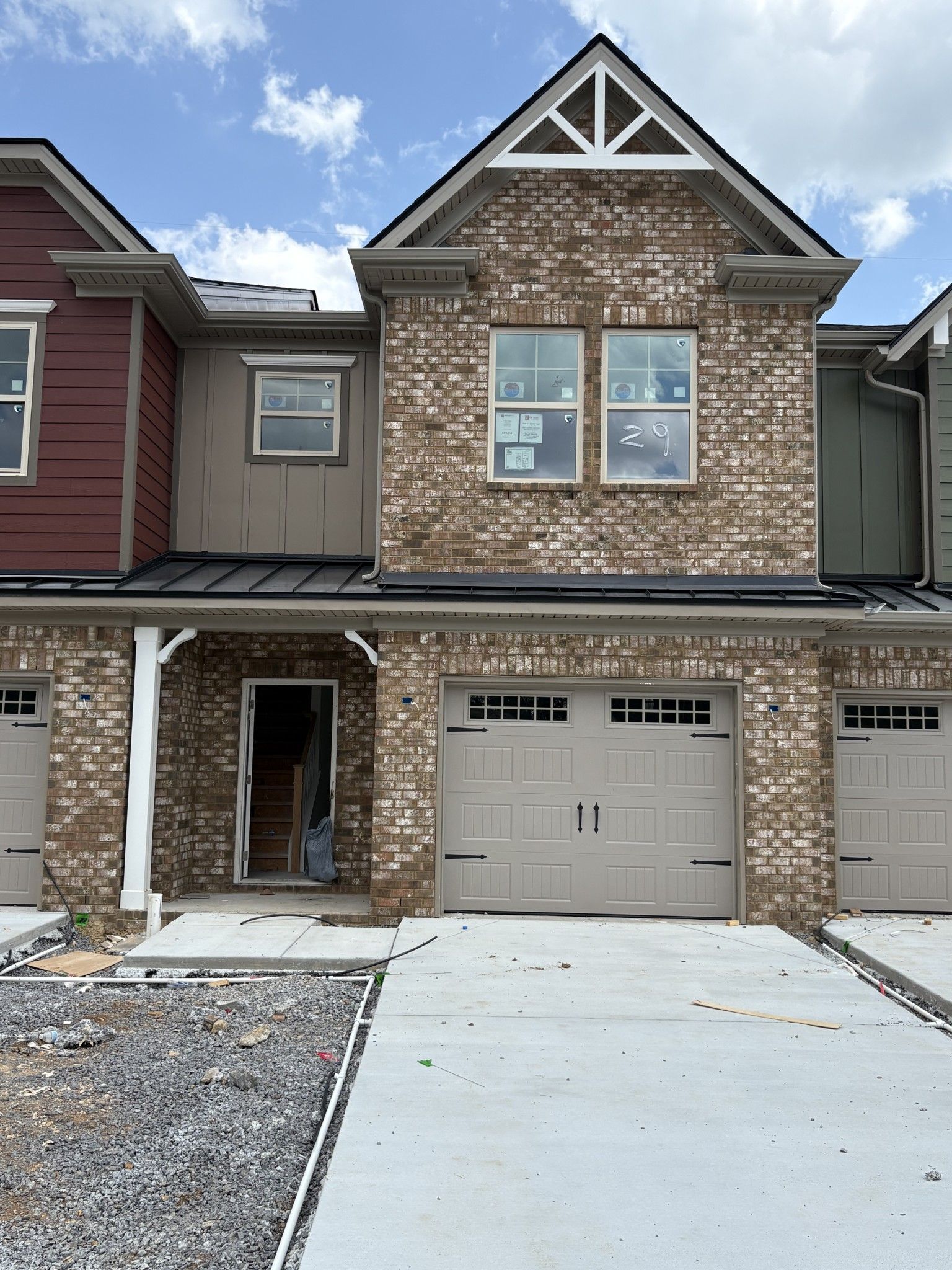 Exterior:Current stage as of 6/23/2025.Unit features 1 Car Garage.
