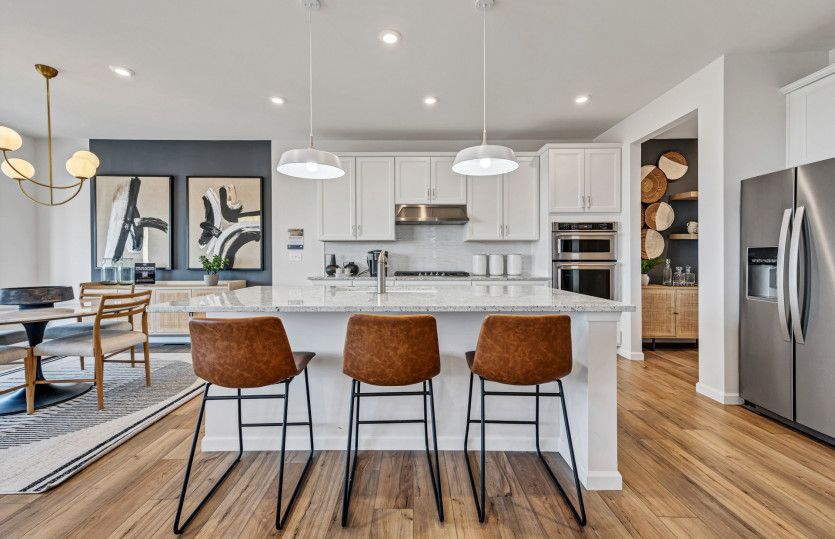 Continental:Kitchen with Pendant Lighting and Stainless Steel Appliances