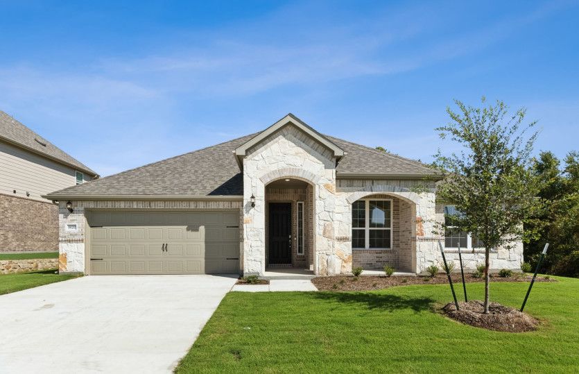 Dunlay:The Dunlay, a one-story home with 2-Car Garage, shown with Home Exterior D