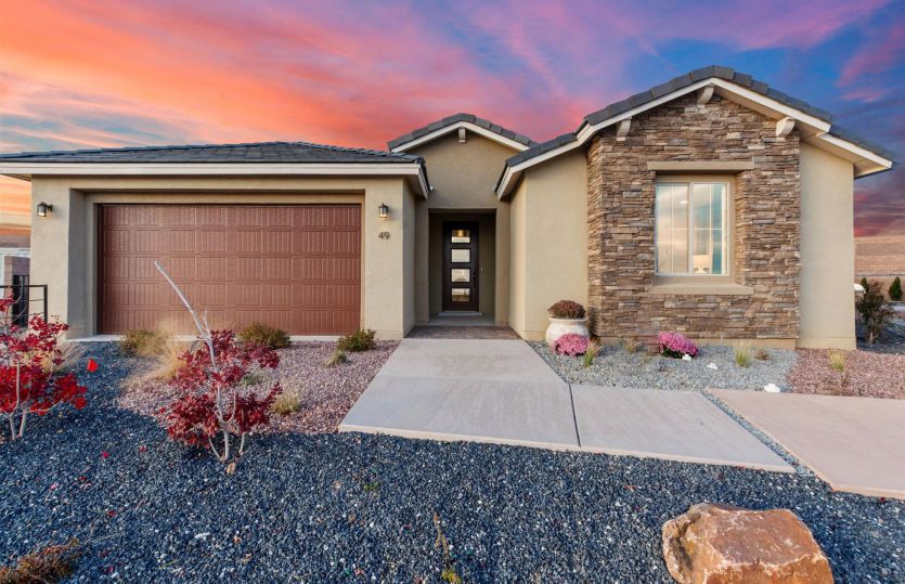 Parklane:Parklane model home showcasing the stone veneer and painted garage door exterior for enhanced curb a