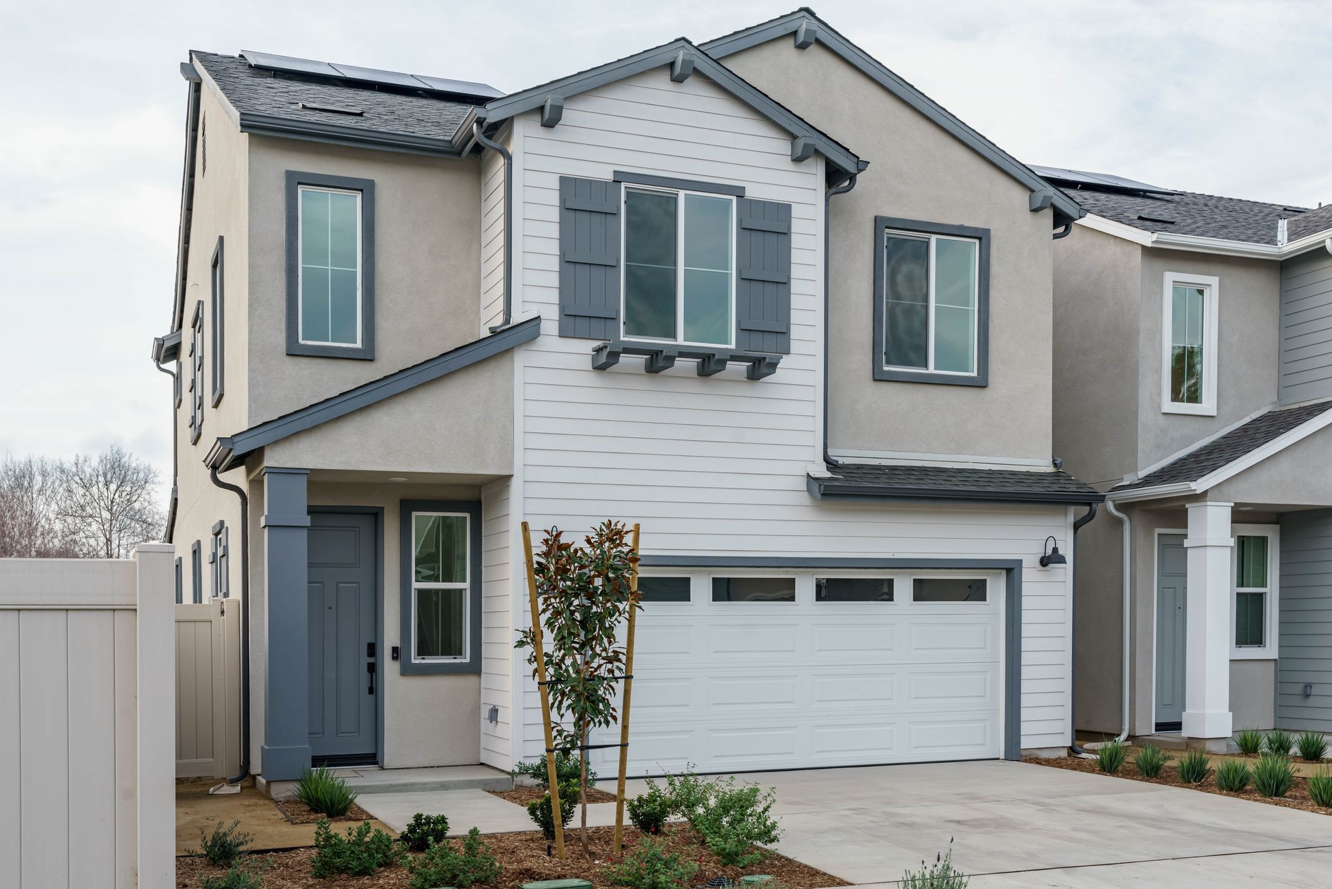 Exterior of Homesite 14:Two-story single-family home with driveway and direct access 2-car garage