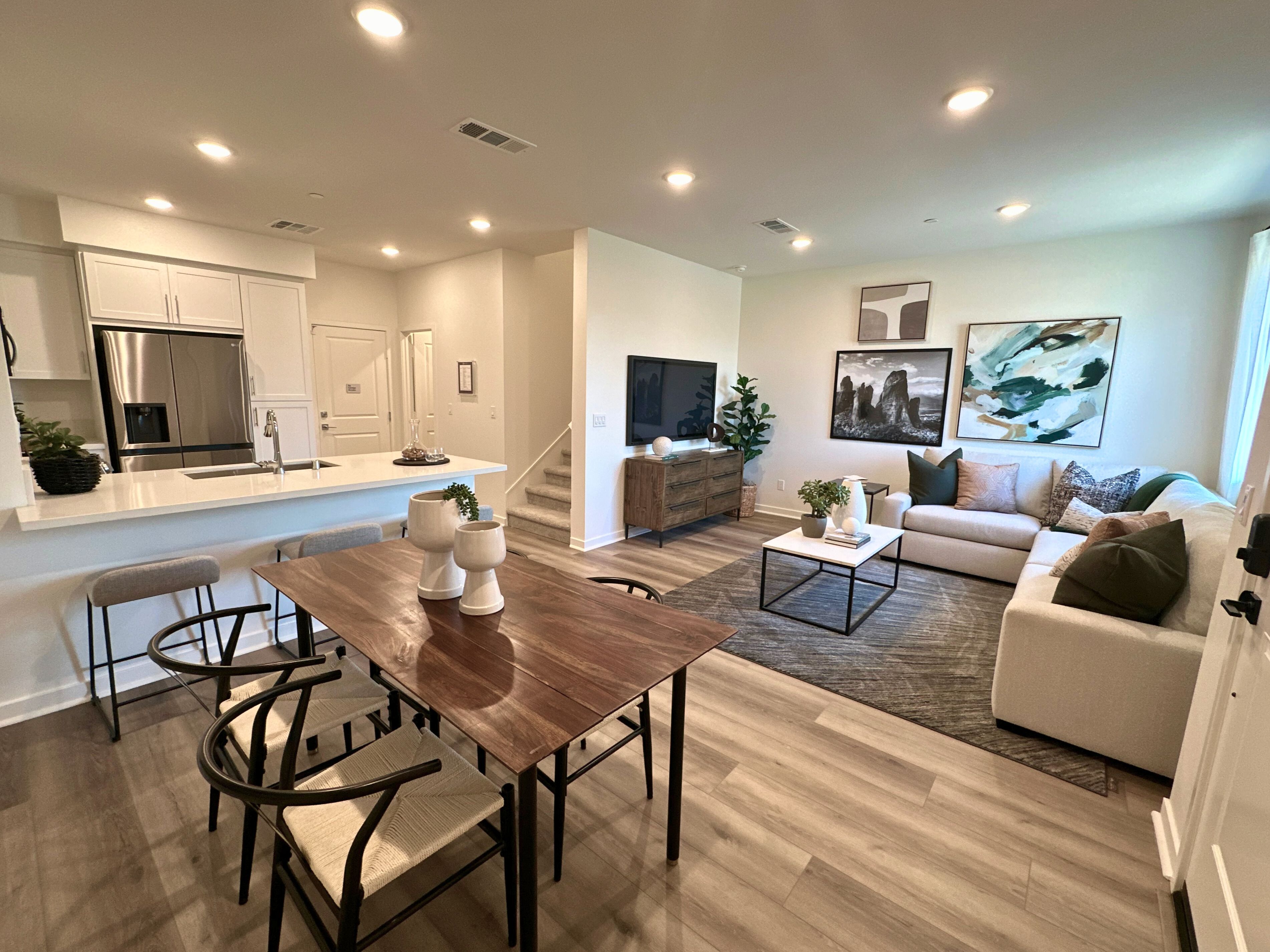 Plan 2 Model Home Great Room:Model home connected living, dining, and kitchen area