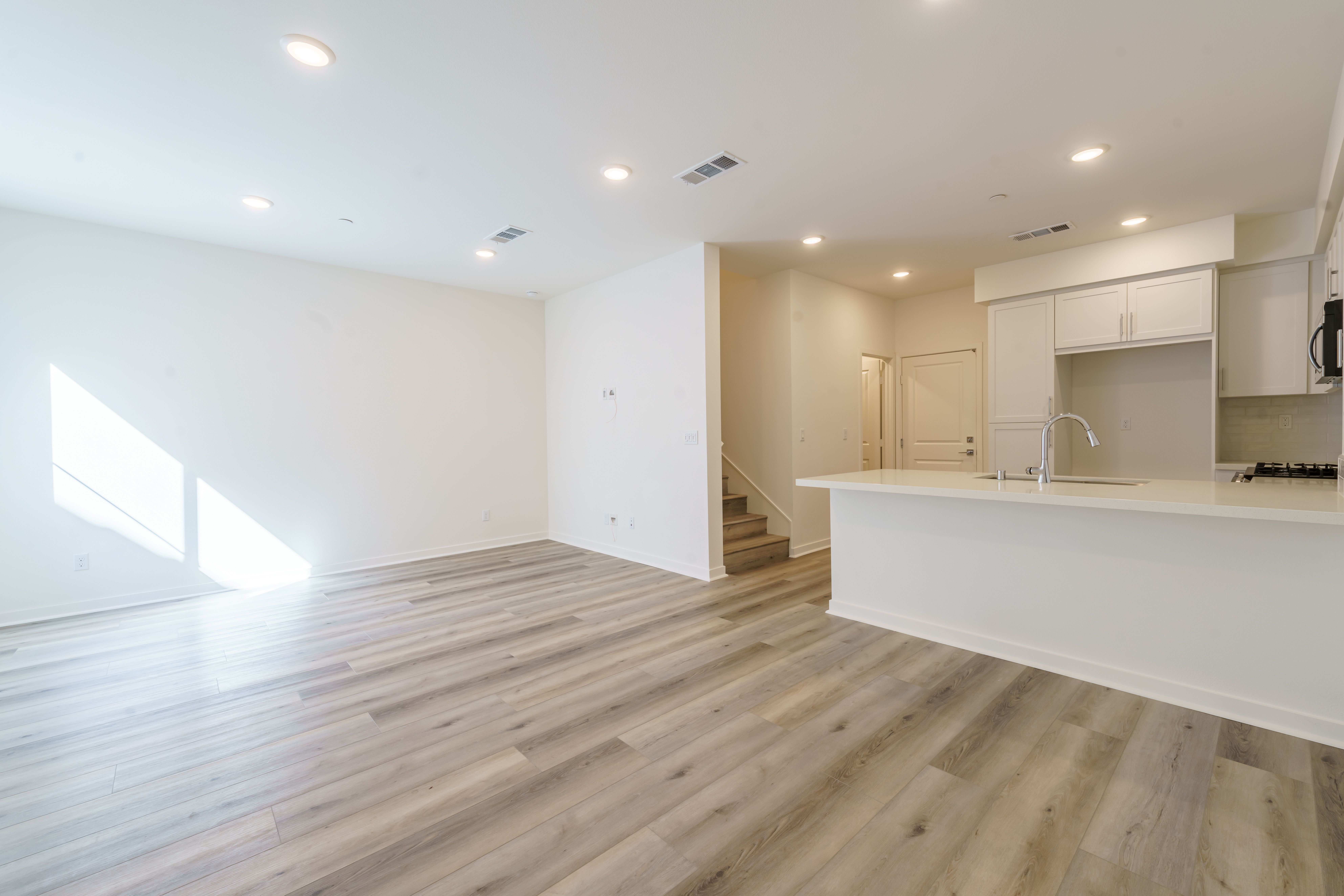Great Room:Spacious first floor with LVP flooring and recessed lighting throughout