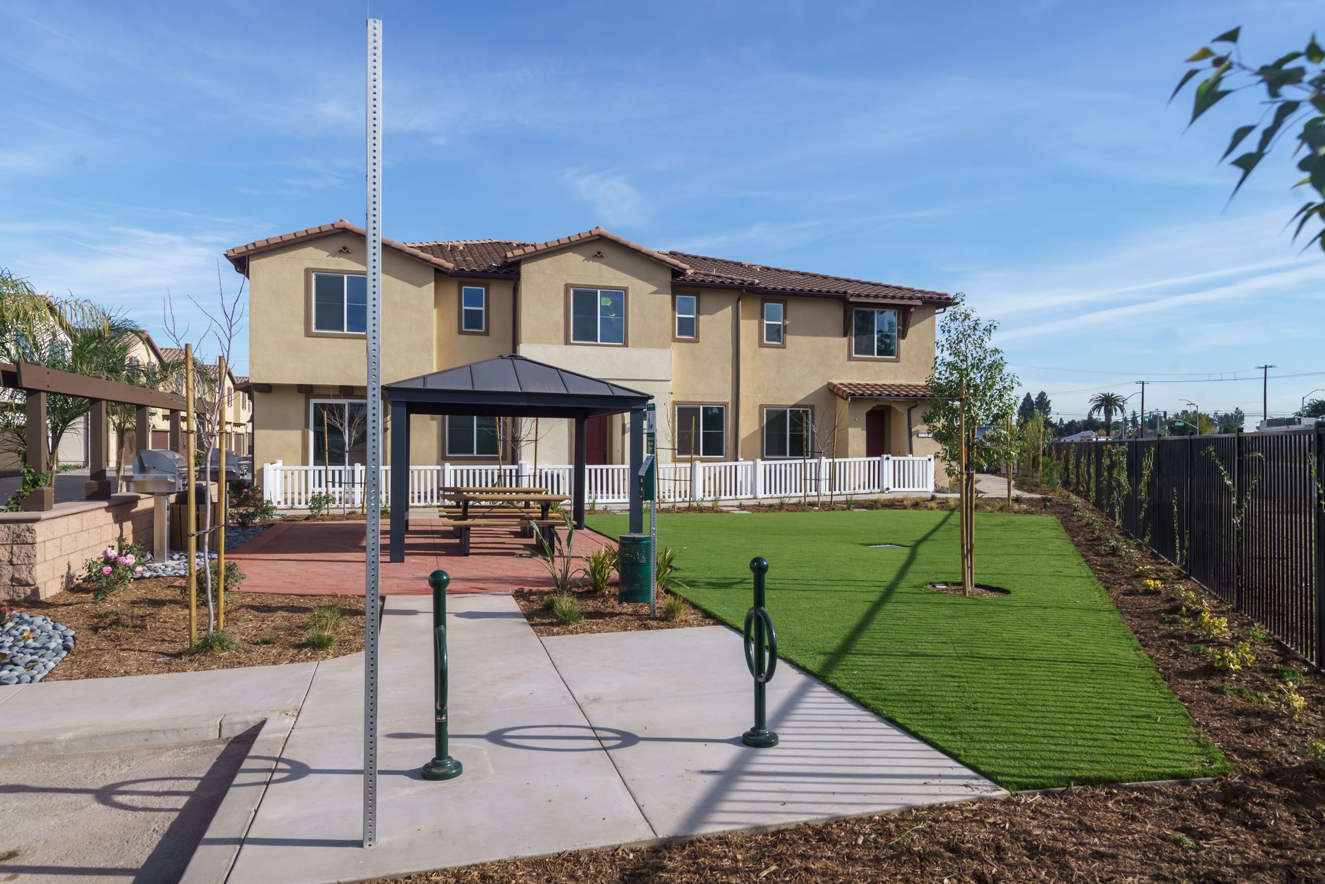 Home Exterior:Home Exterior With Common Area with BBQ's, Picnic Area, and Bicycle Storage