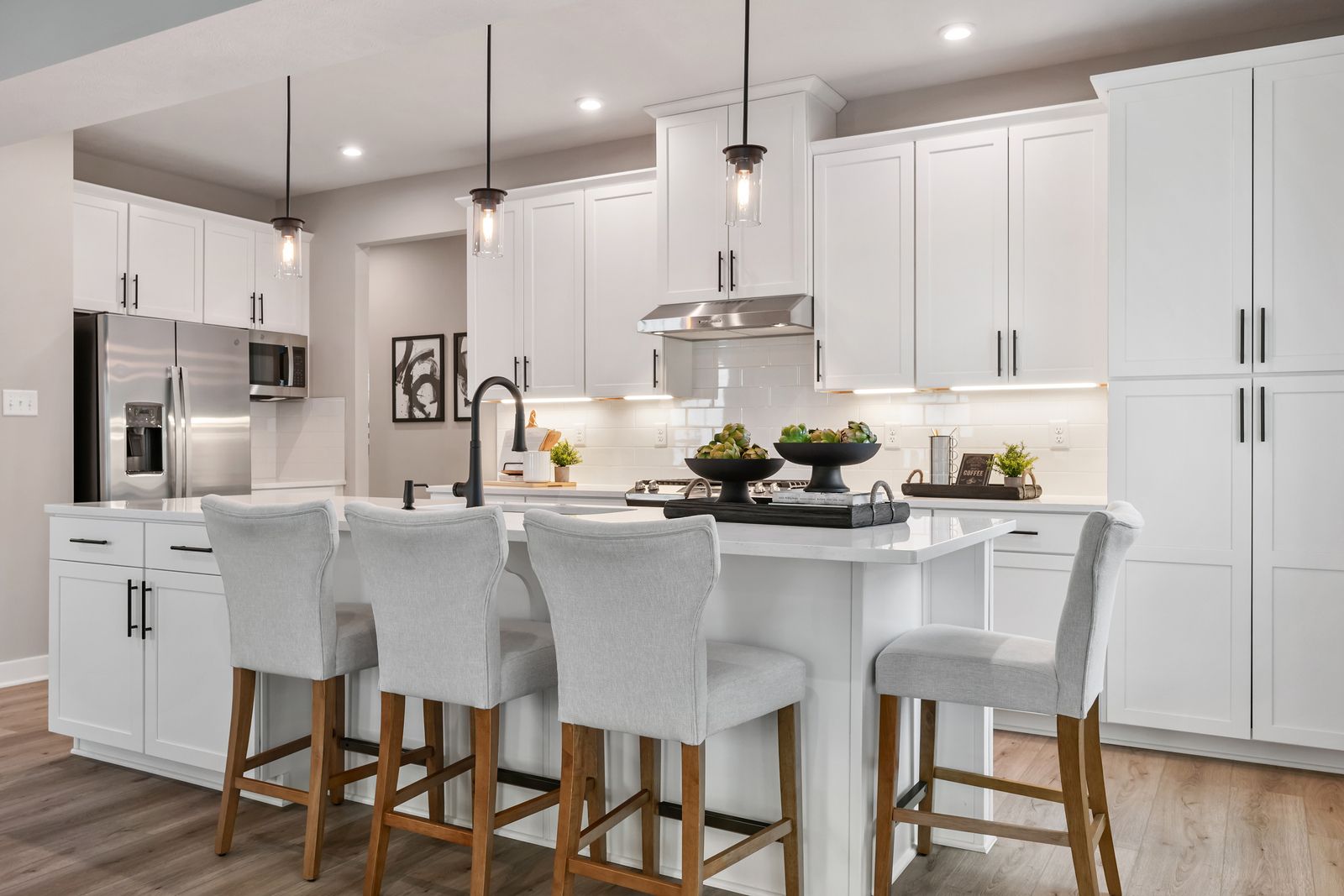 Quartz countertops, tile backsplashes, & soft-close cabinets - all included, no extra cost.
