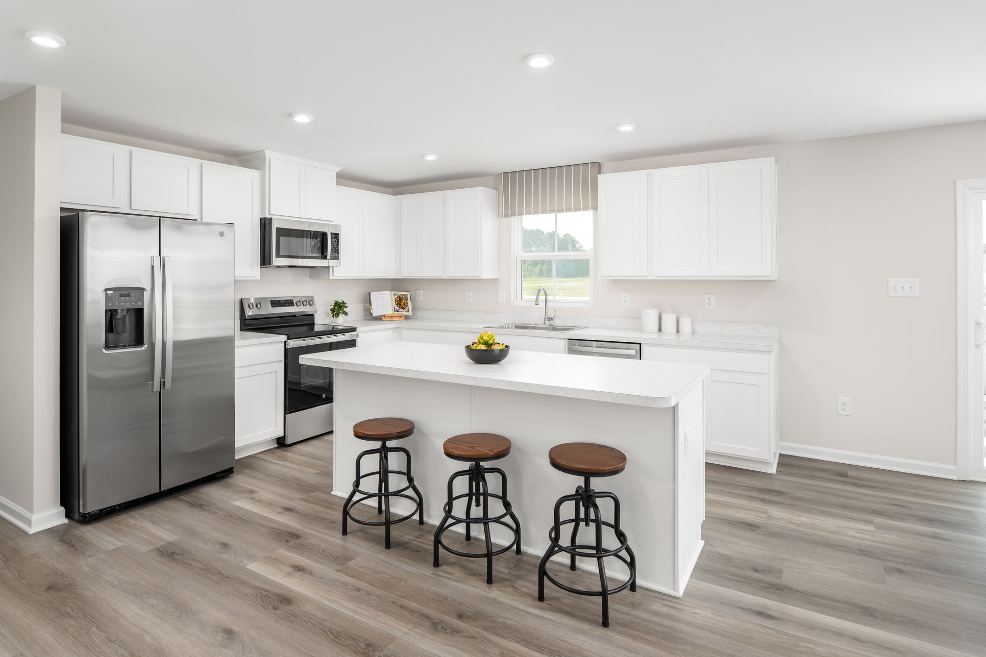 Explore open-concept floor plans with included features like your kitchen island and appliances!