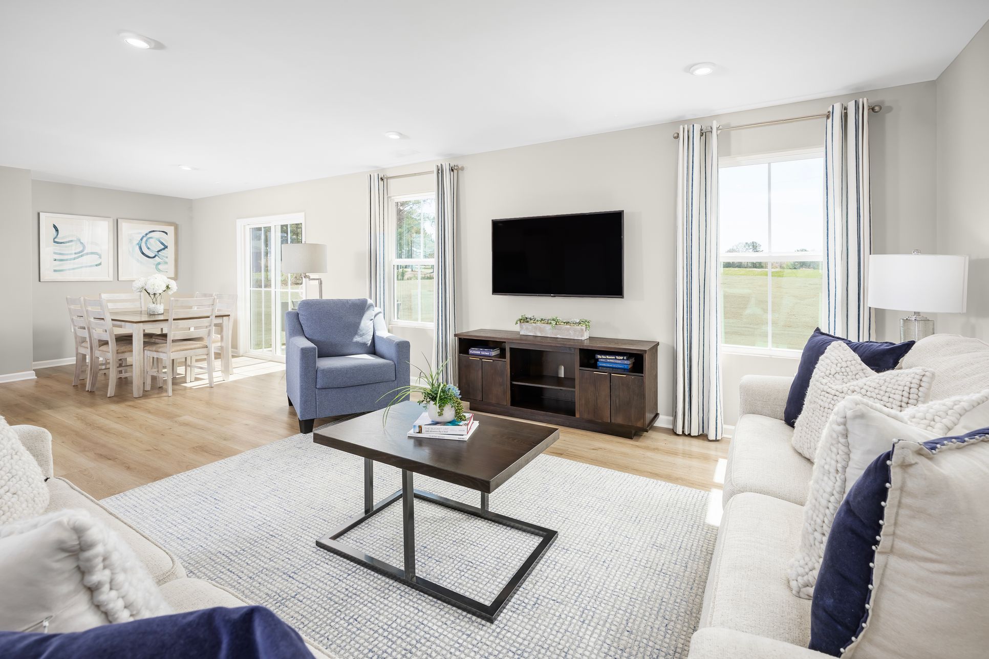 Unwind in a light-filled living room that feels warm, welcoming, and effortless