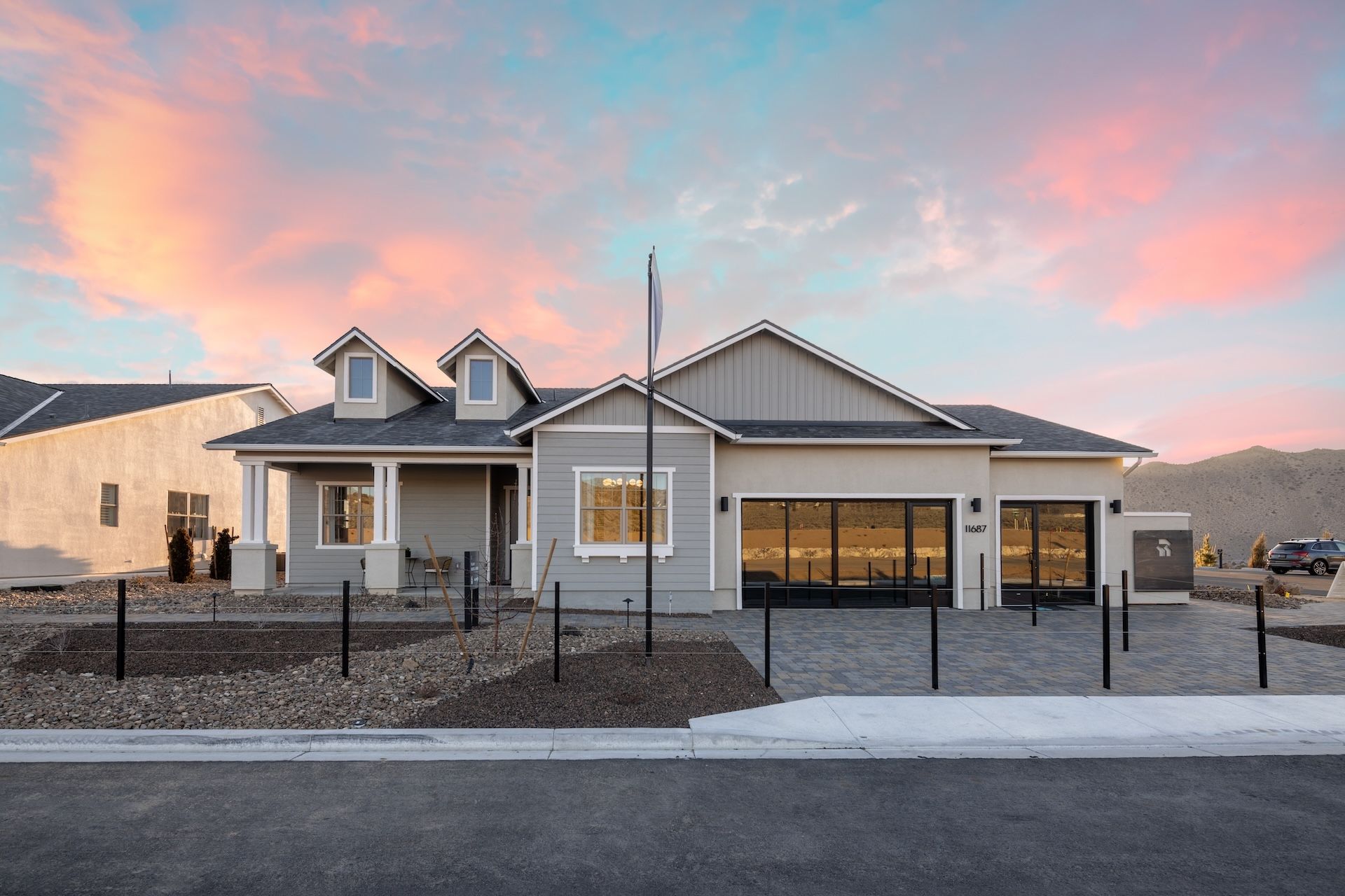 Front exterior of Shadow Hills Plan 1 American Contemporary model home, Color Scheme 1 at sunset.:Color Scheme 1